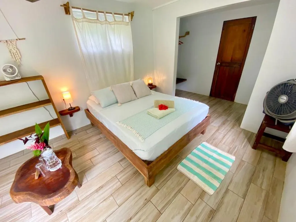 Bed in Bird Island Bungalows