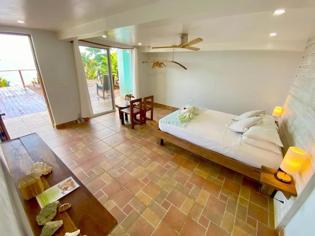 Photo of the whole room, Bed in Bird Island Bungalows