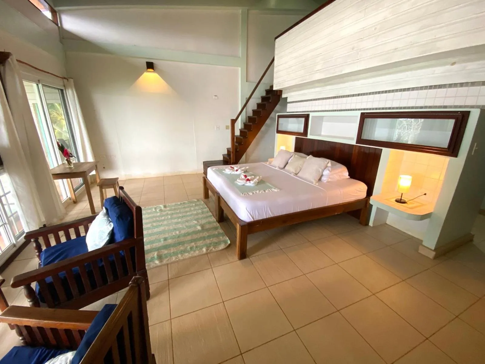 Bed in Bird Island Bungalows