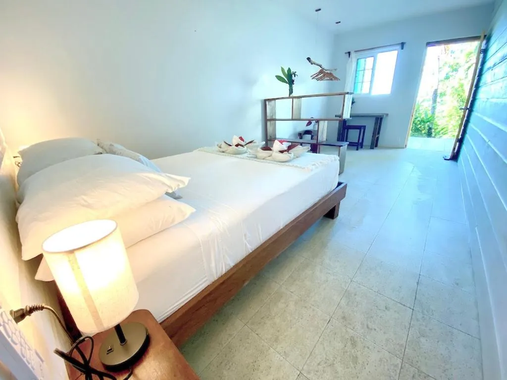 Bed in Bird Island Bungalows