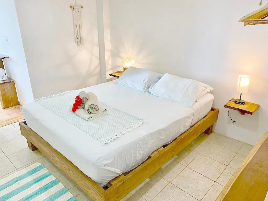 Bed in Bird Island Bungalows