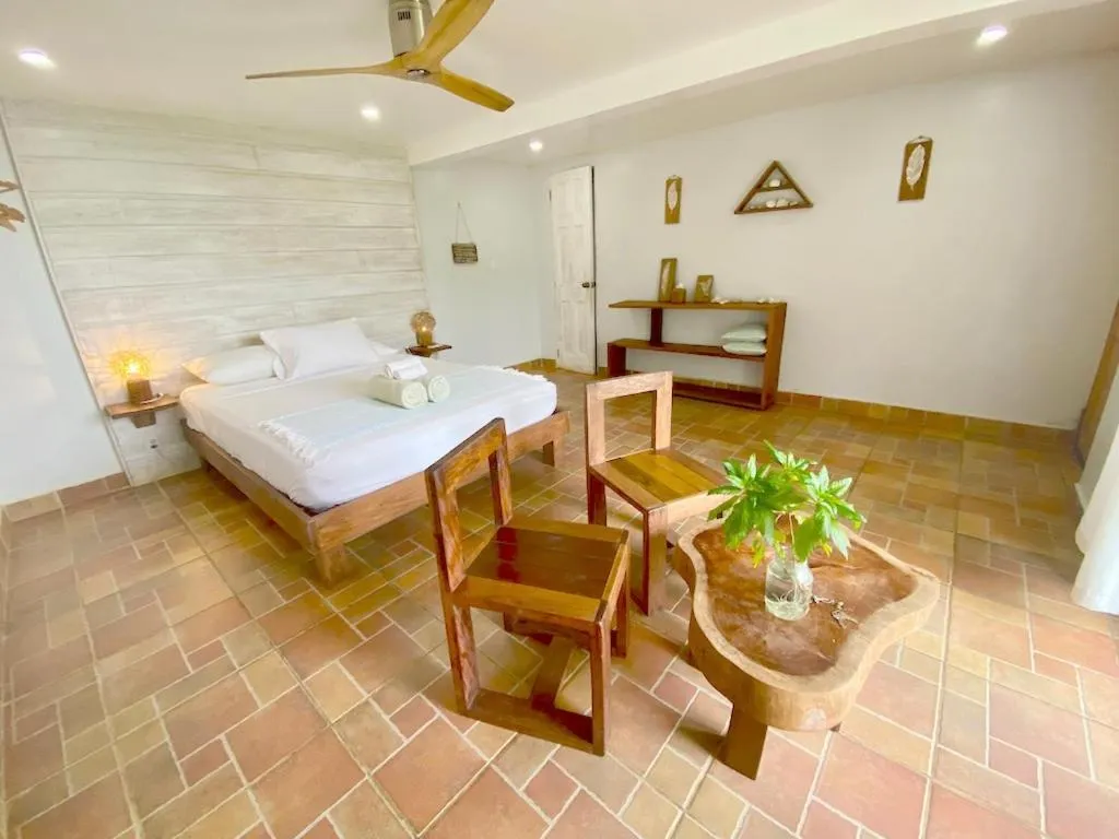 Bed in Bird Island Bungalows