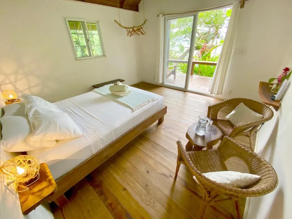 Photo of the whole room, Bed in Bird Island Bungalows