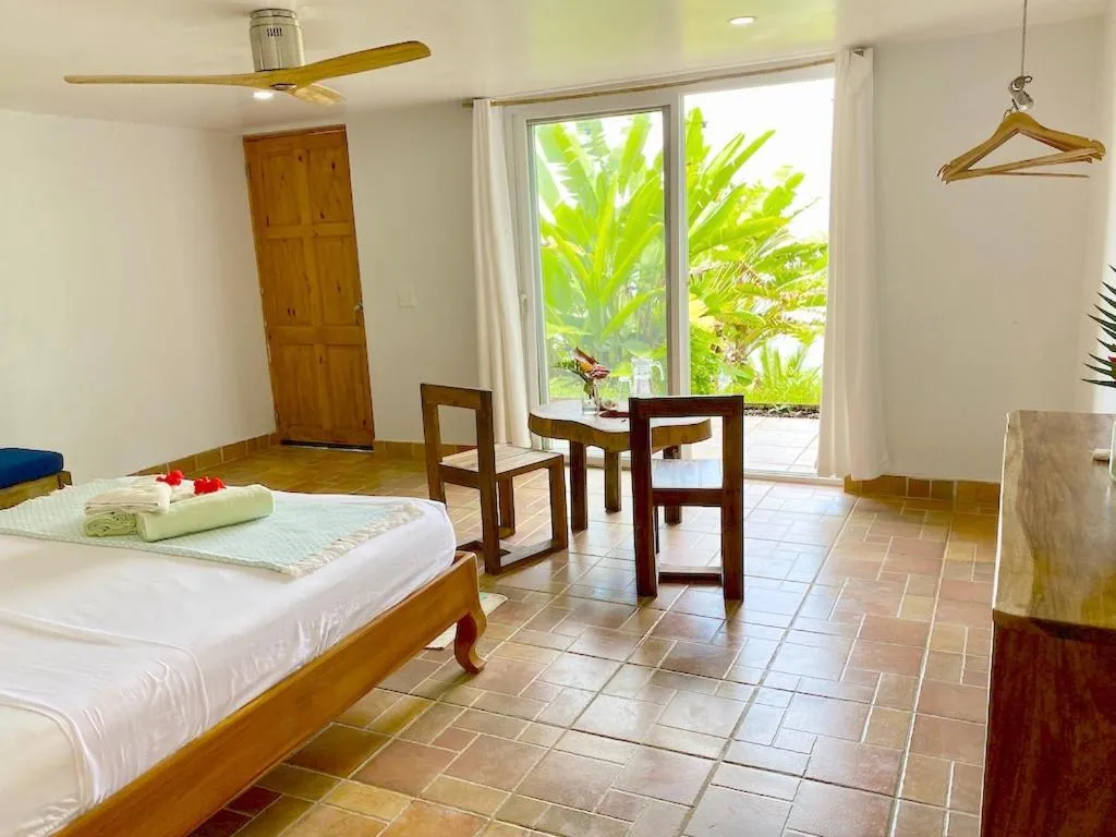 Bed in Bird Island Bungalows