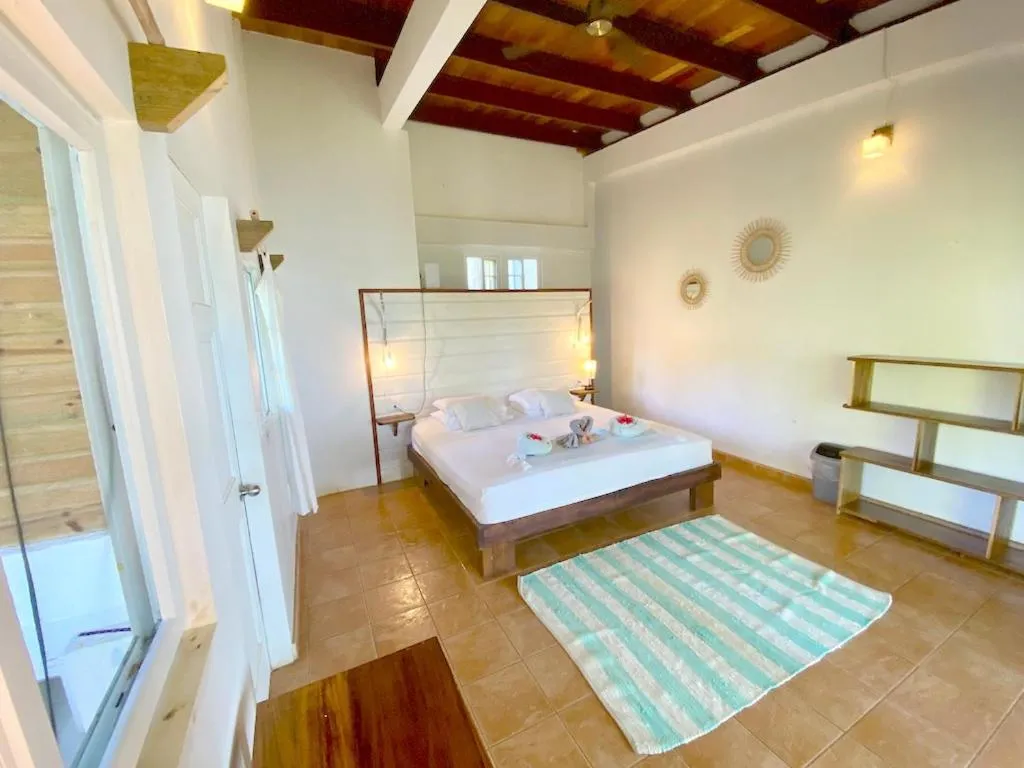 Bed in Bird Island Bungalows