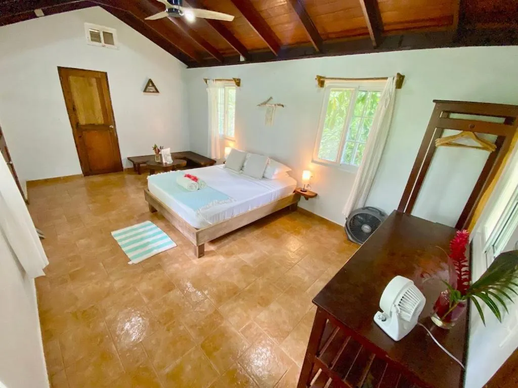 Bed in Bird Island Bungalows