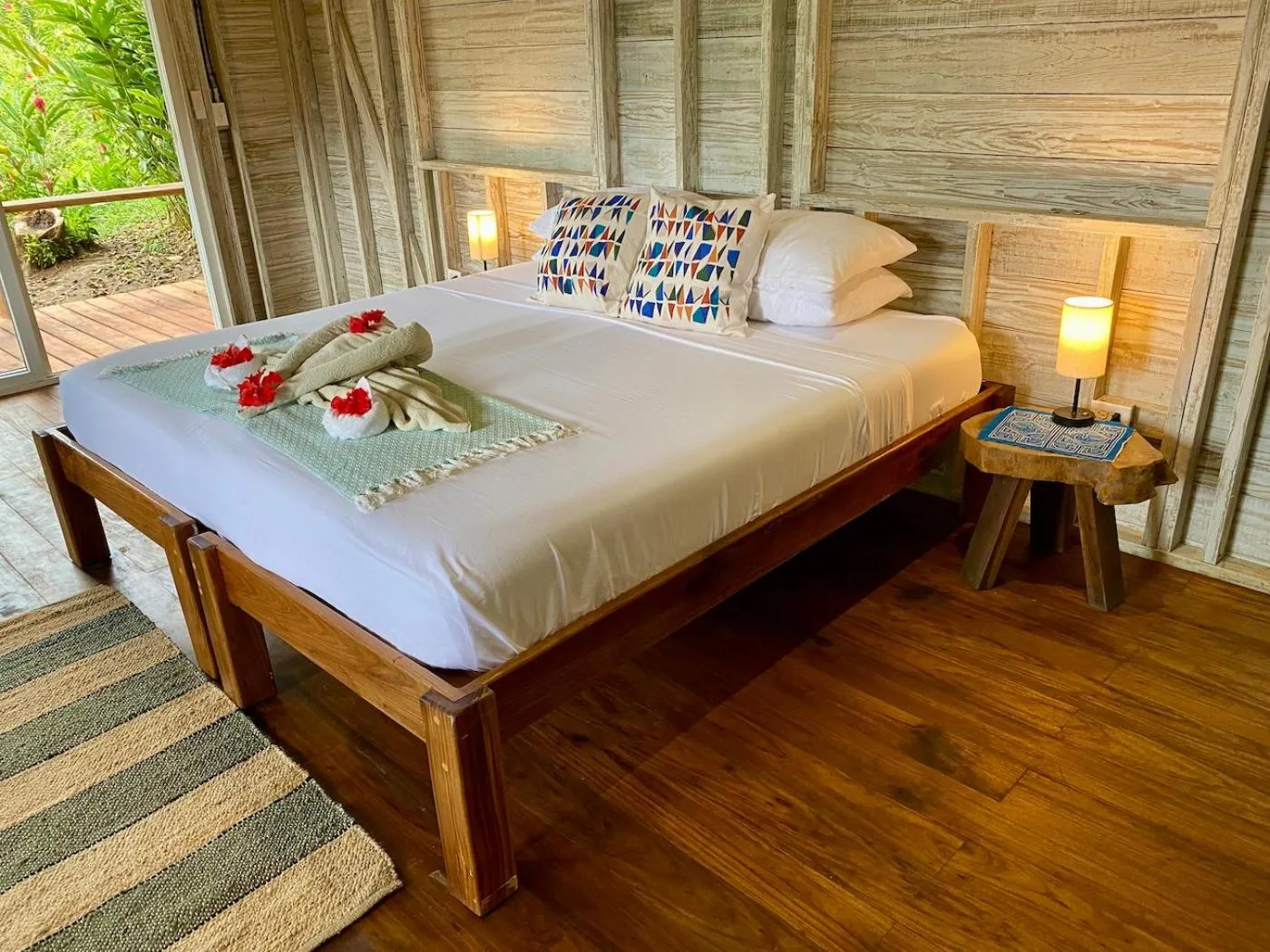 Bed in Bird Island Bungalows