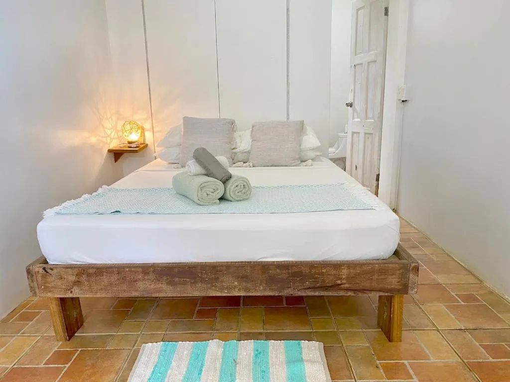 Bed in Bird Island Bungalows