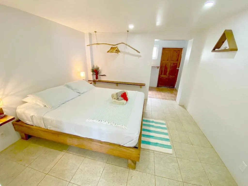 Bed in Bird Island Bungalows