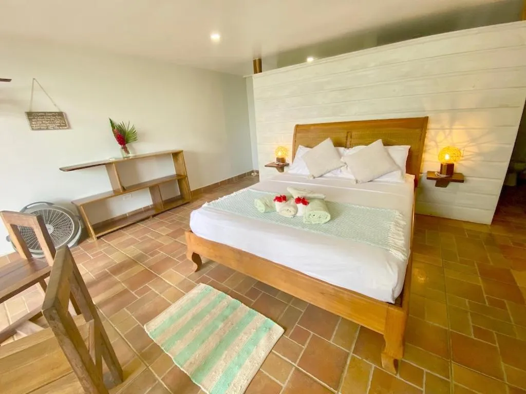 Bed in Bird Island Bungalows