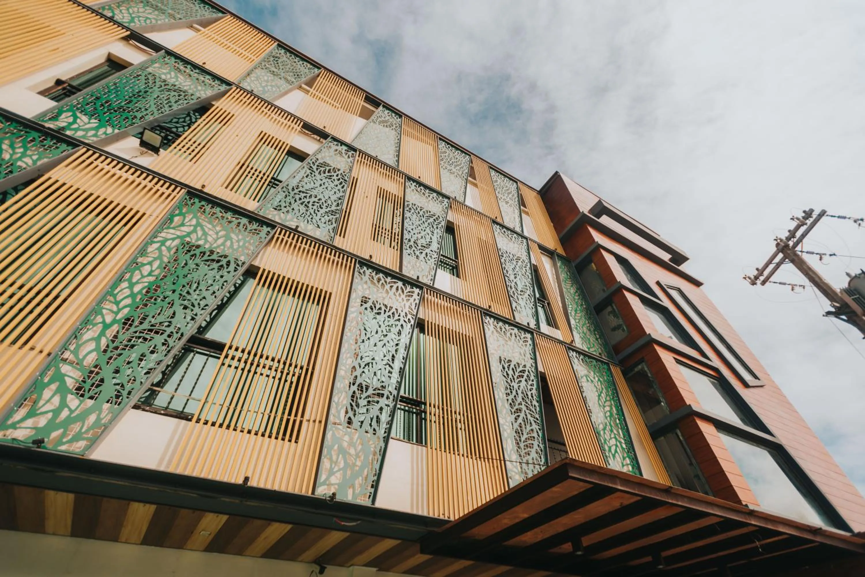 Property building in SureStay Plus Hotel by Best Western AC LUXE Angeles City