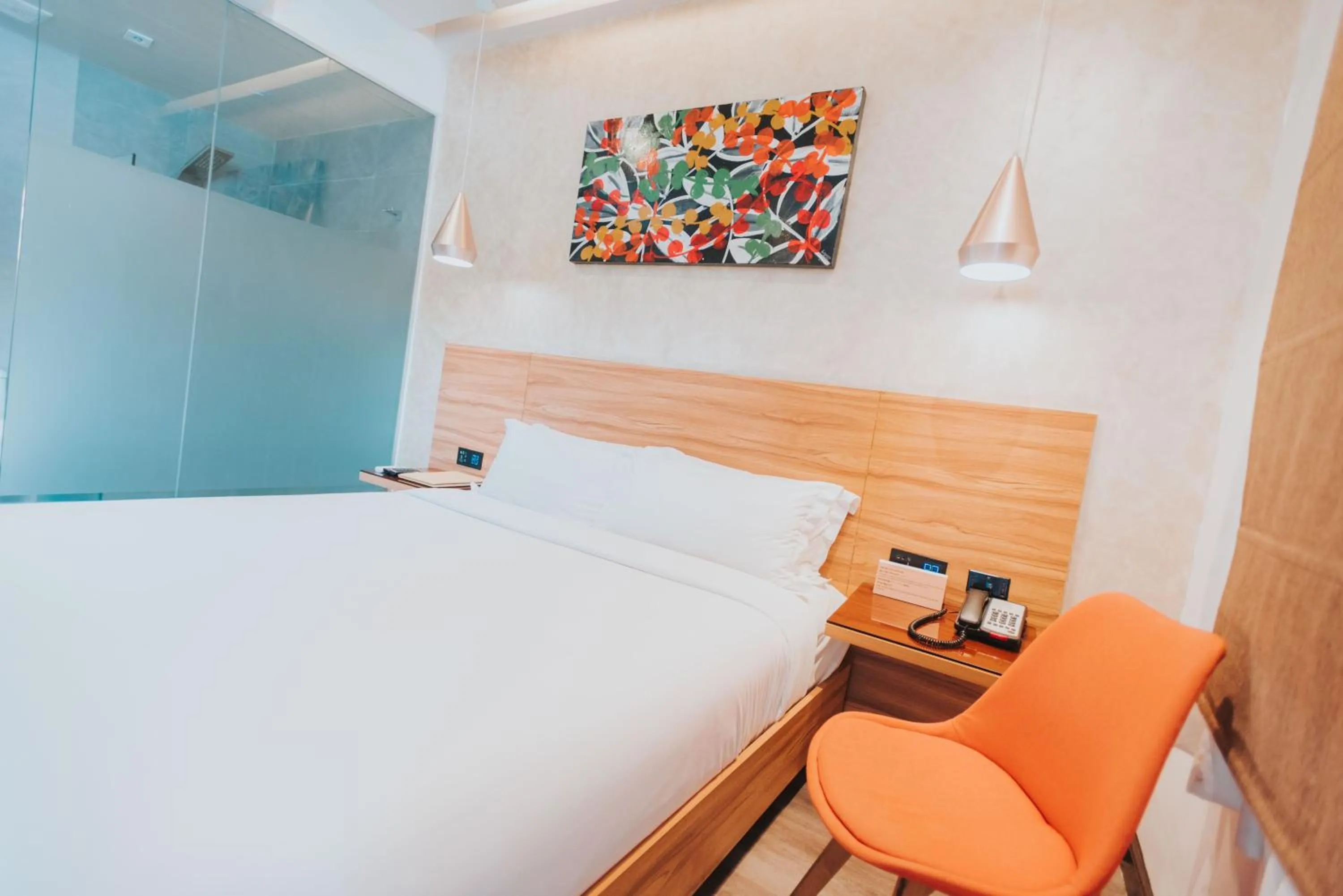 Bed in SureStay Plus Hotel by Best Western AC LUXE Angeles City