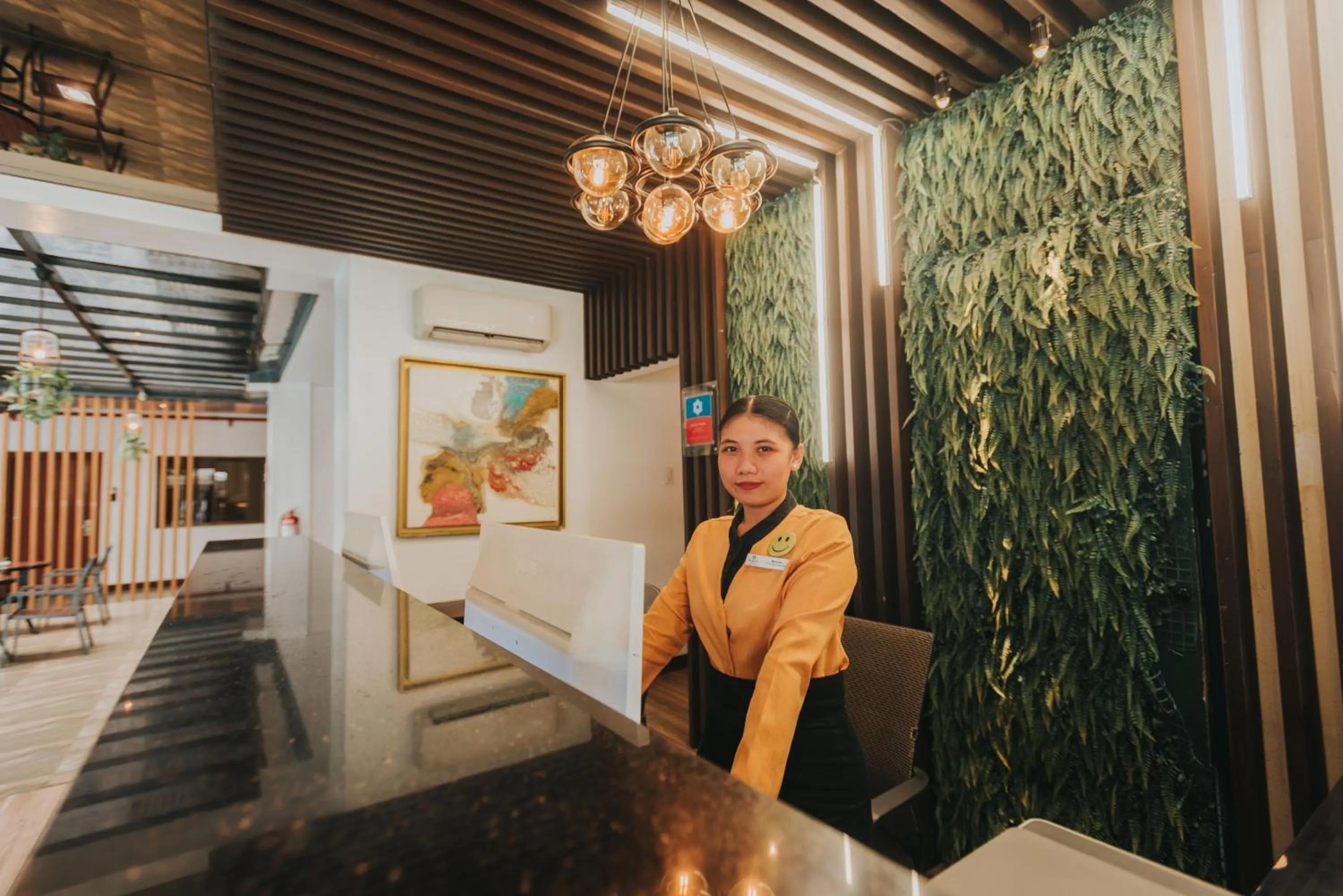 Lobby or reception in SureStay Plus Hotel by Best Western AC LUXE Angeles City