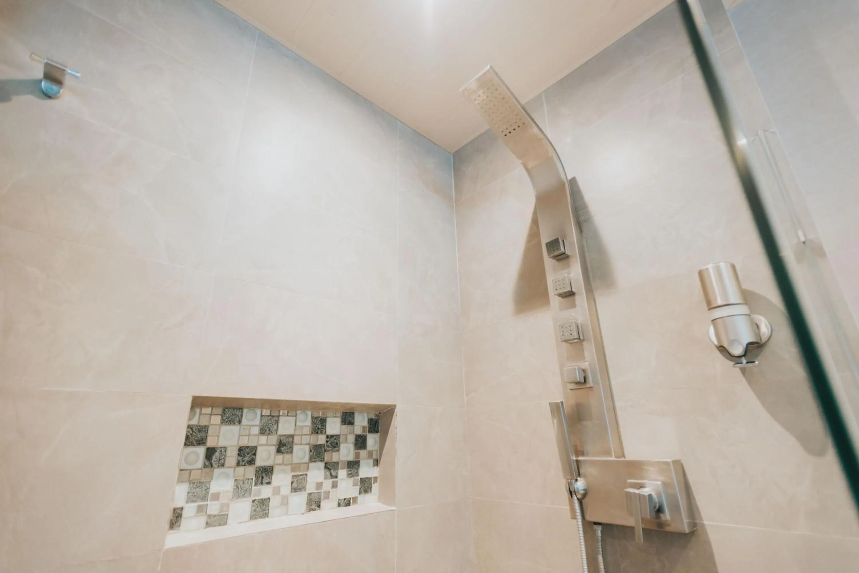 Bathroom in SureStay Plus Hotel by Best Western AC LUXE Angeles City