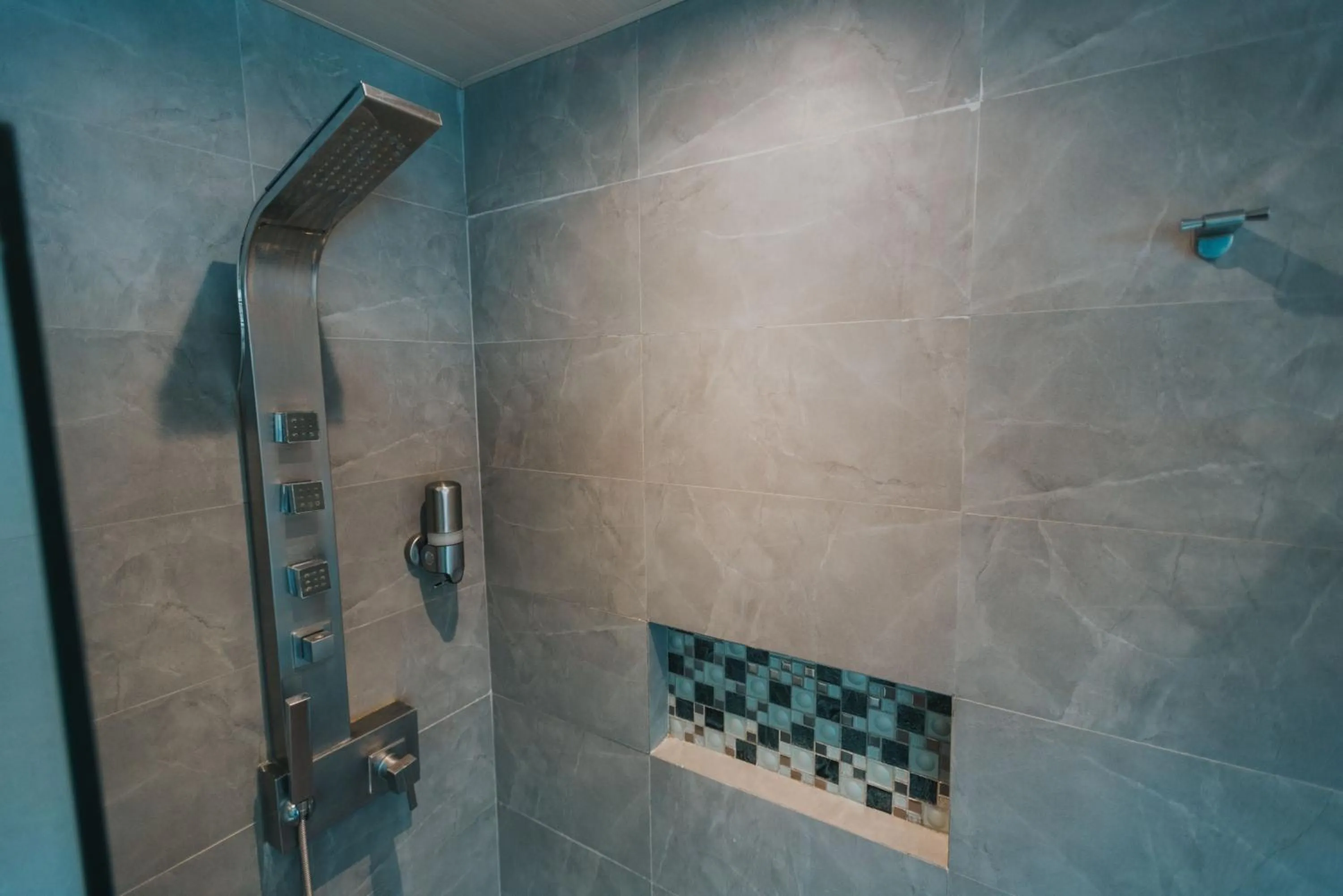 Bathroom in SureStay Plus Hotel by Best Western AC LUXE Angeles City