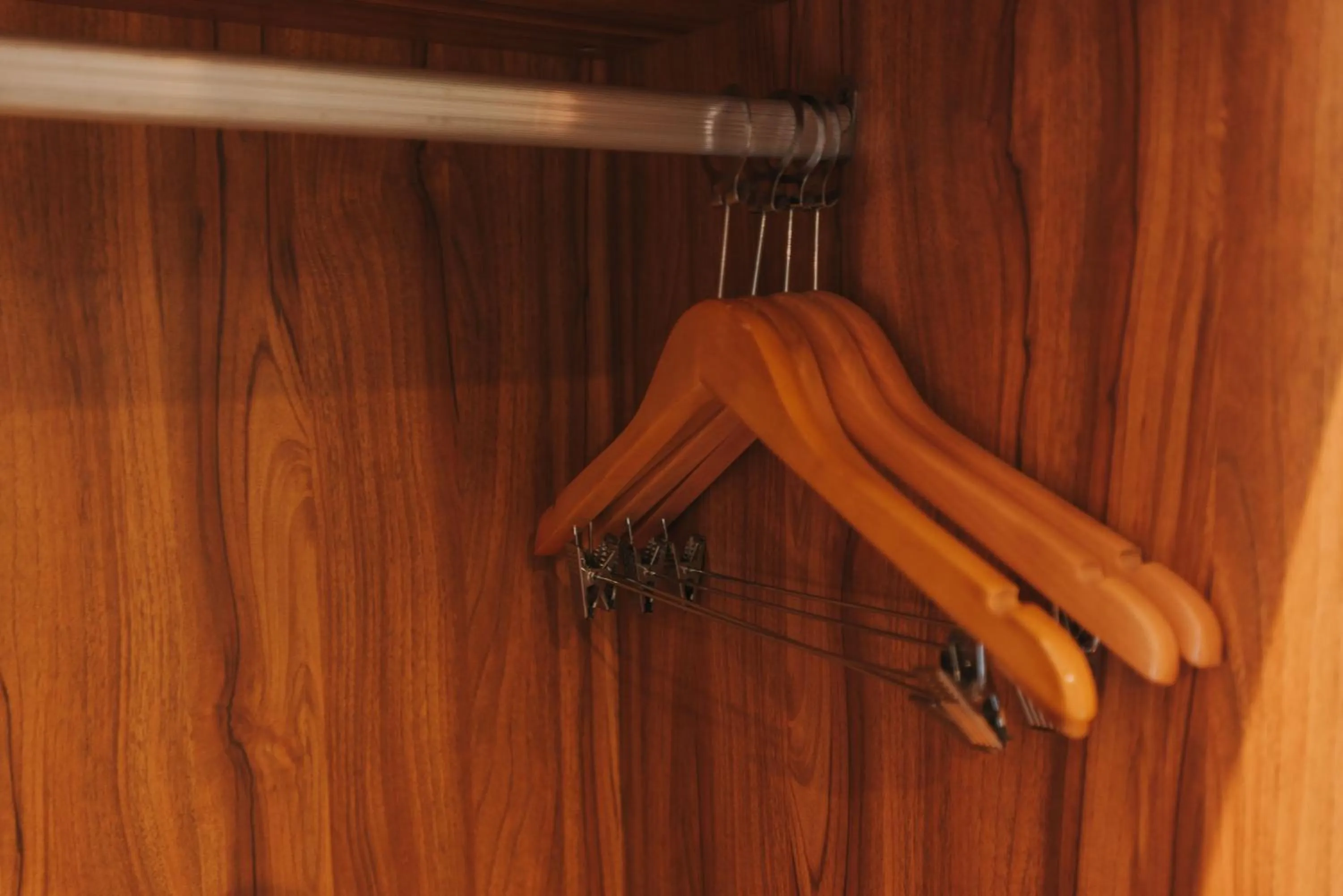 wardrobe in SureStay Plus Hotel by Best Western AC LUXE Angeles City