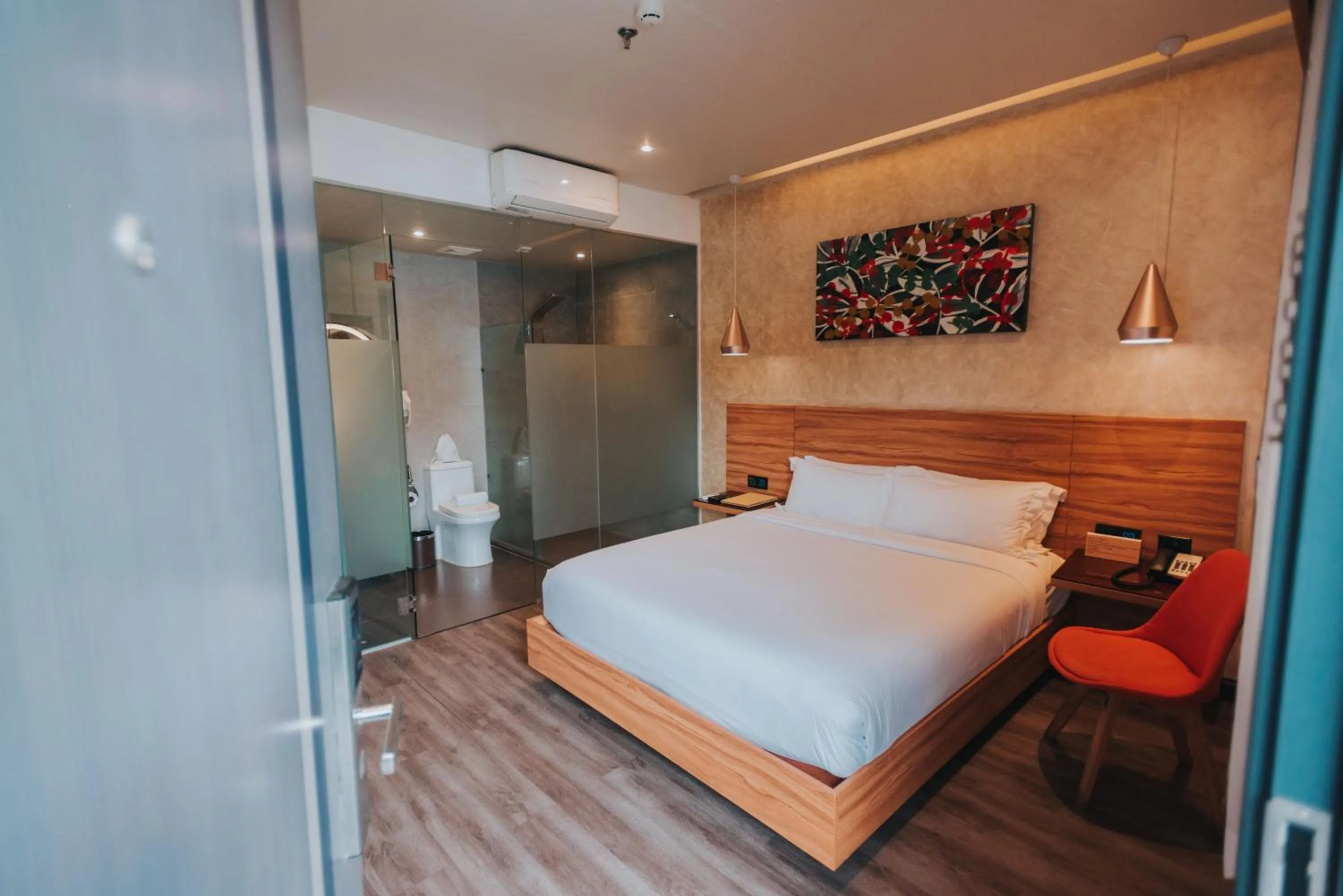Bed in SureStay Plus Hotel by Best Western AC LUXE Angeles City