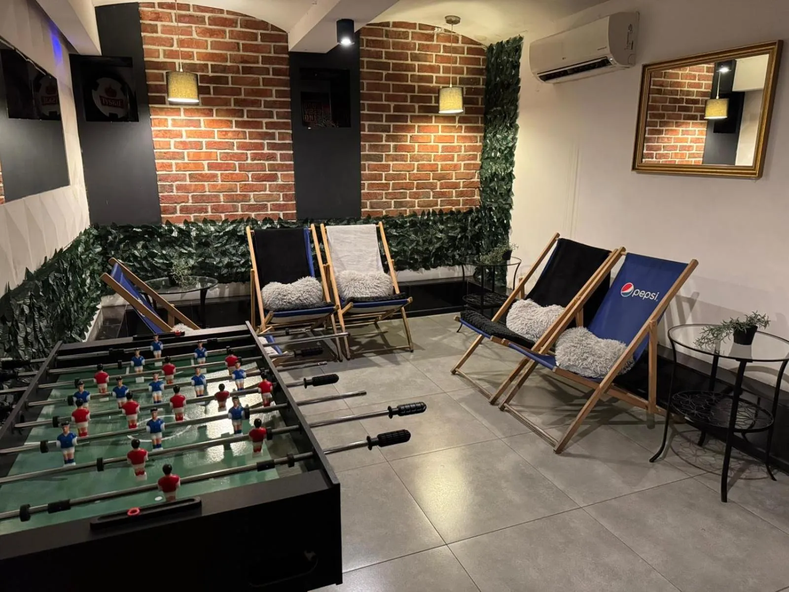 Communal lounge/ TV room in Greg&Tom Party Hostel