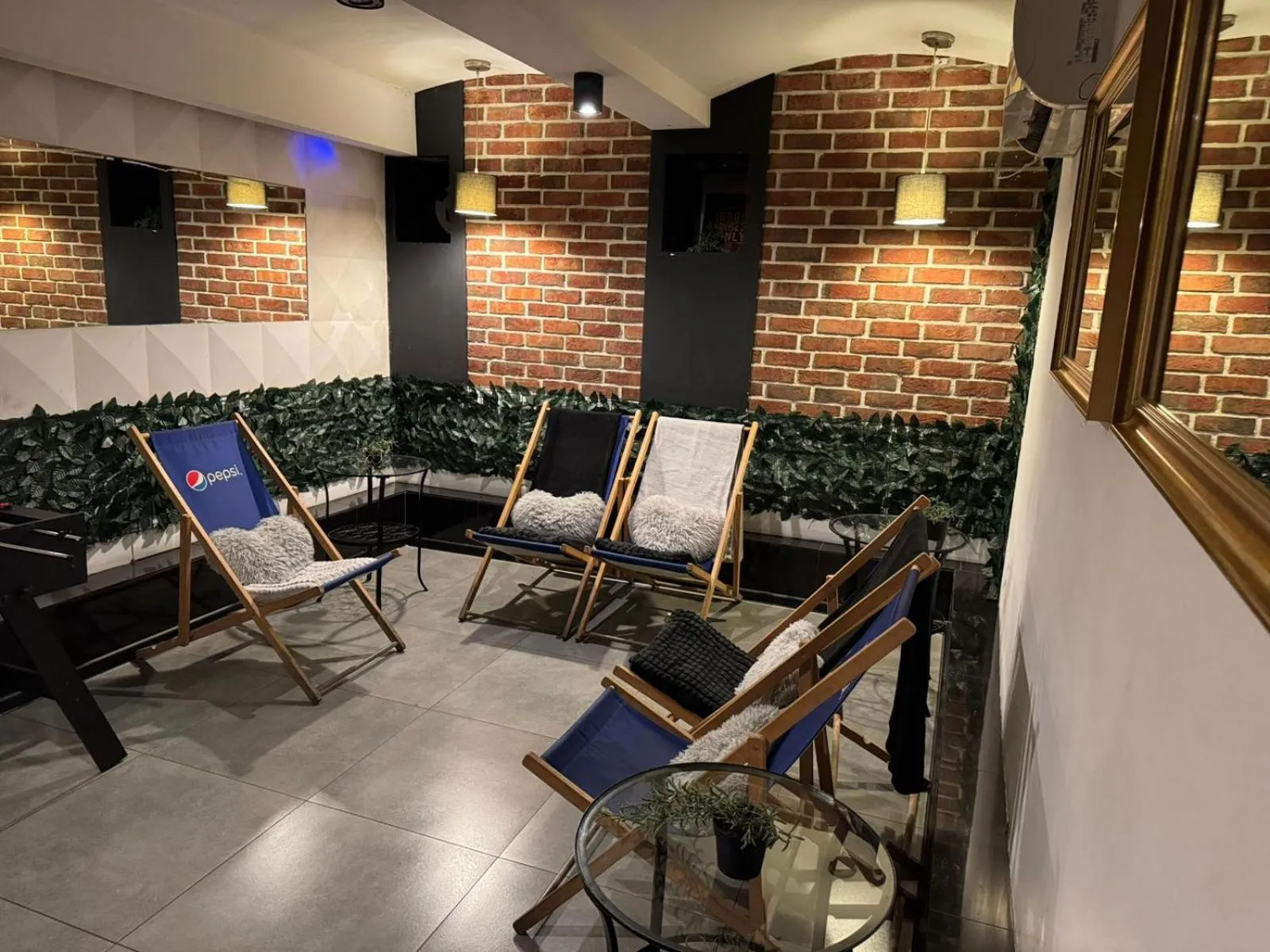 Communal lounge/ TV room in Greg&Tom Party Hostel