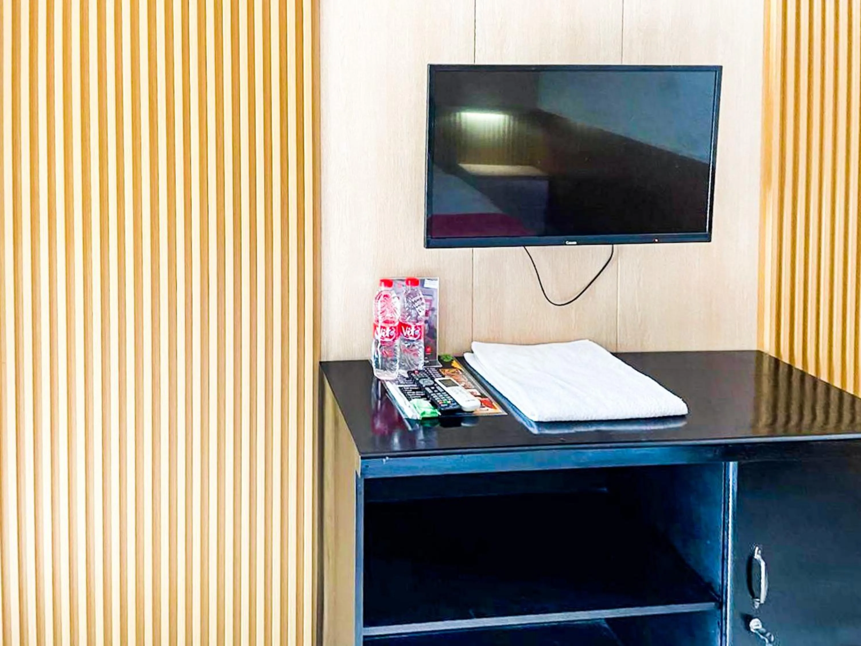 TV and multimedia in RedDoorz Syariah Plus near Banyuwangi Airport