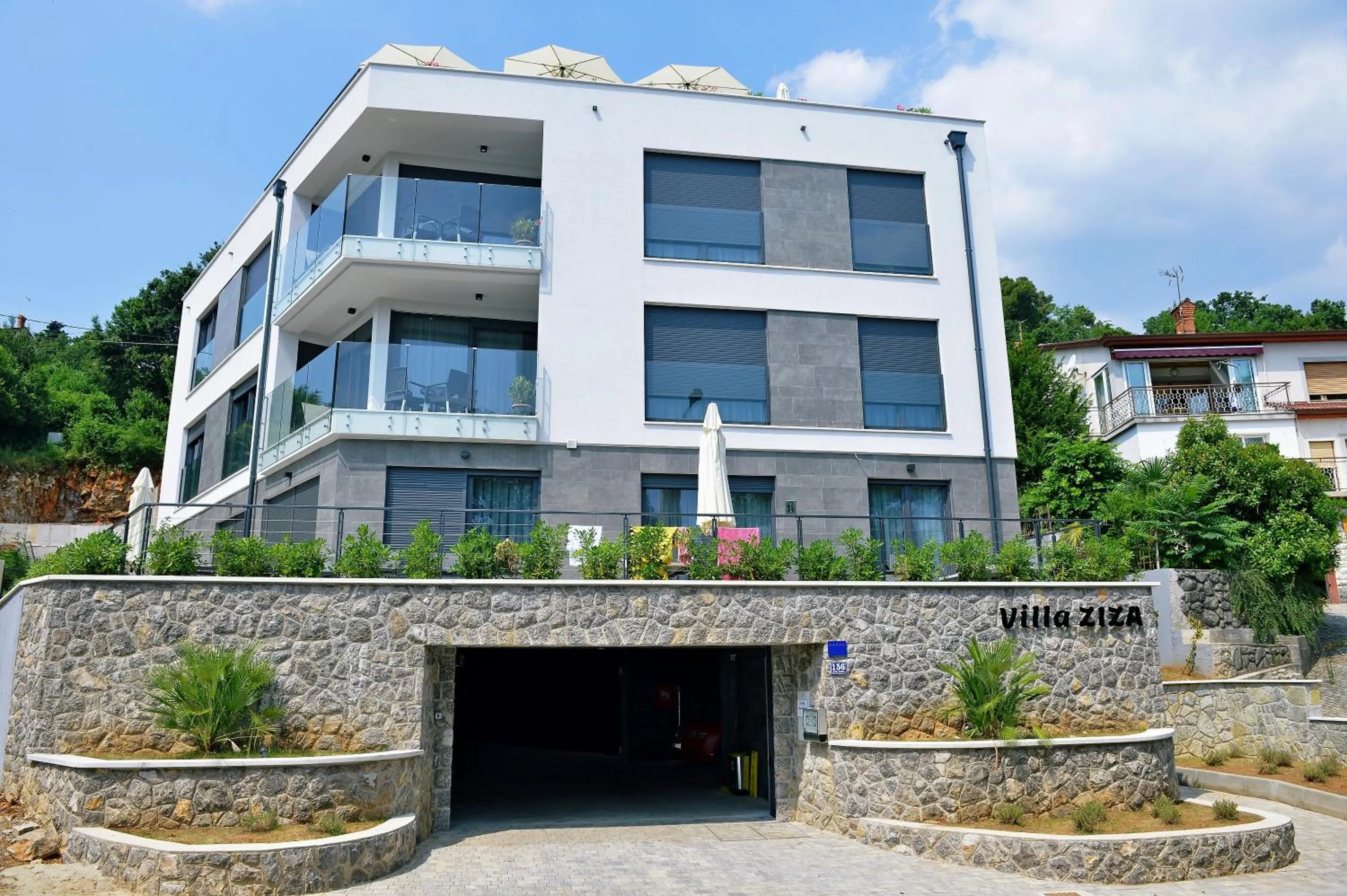 Property building in Apartments in Villa Ziza, rooftop swimming pool