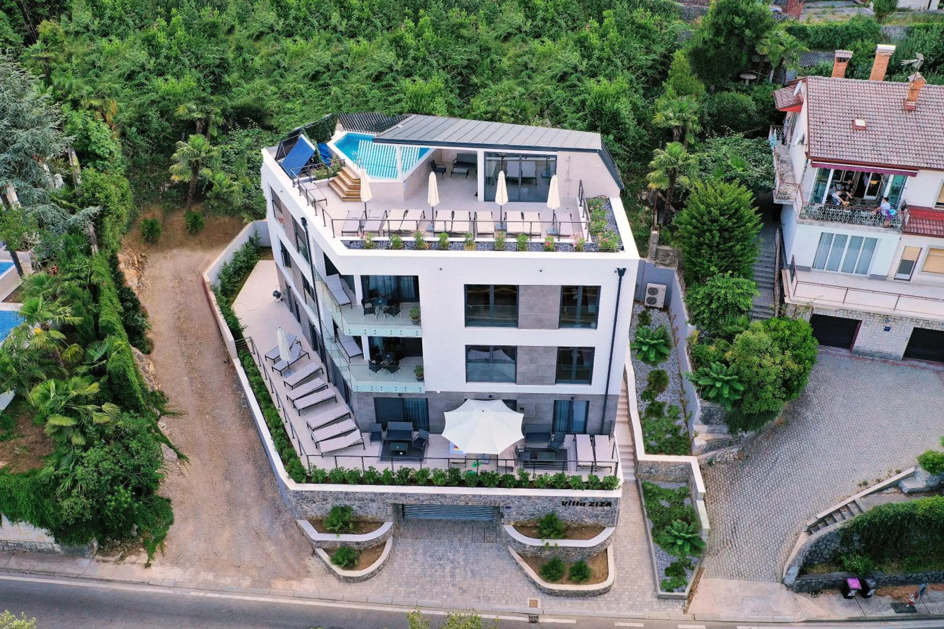 Property building in Apartments in Villa Ziza, rooftop swimming pool