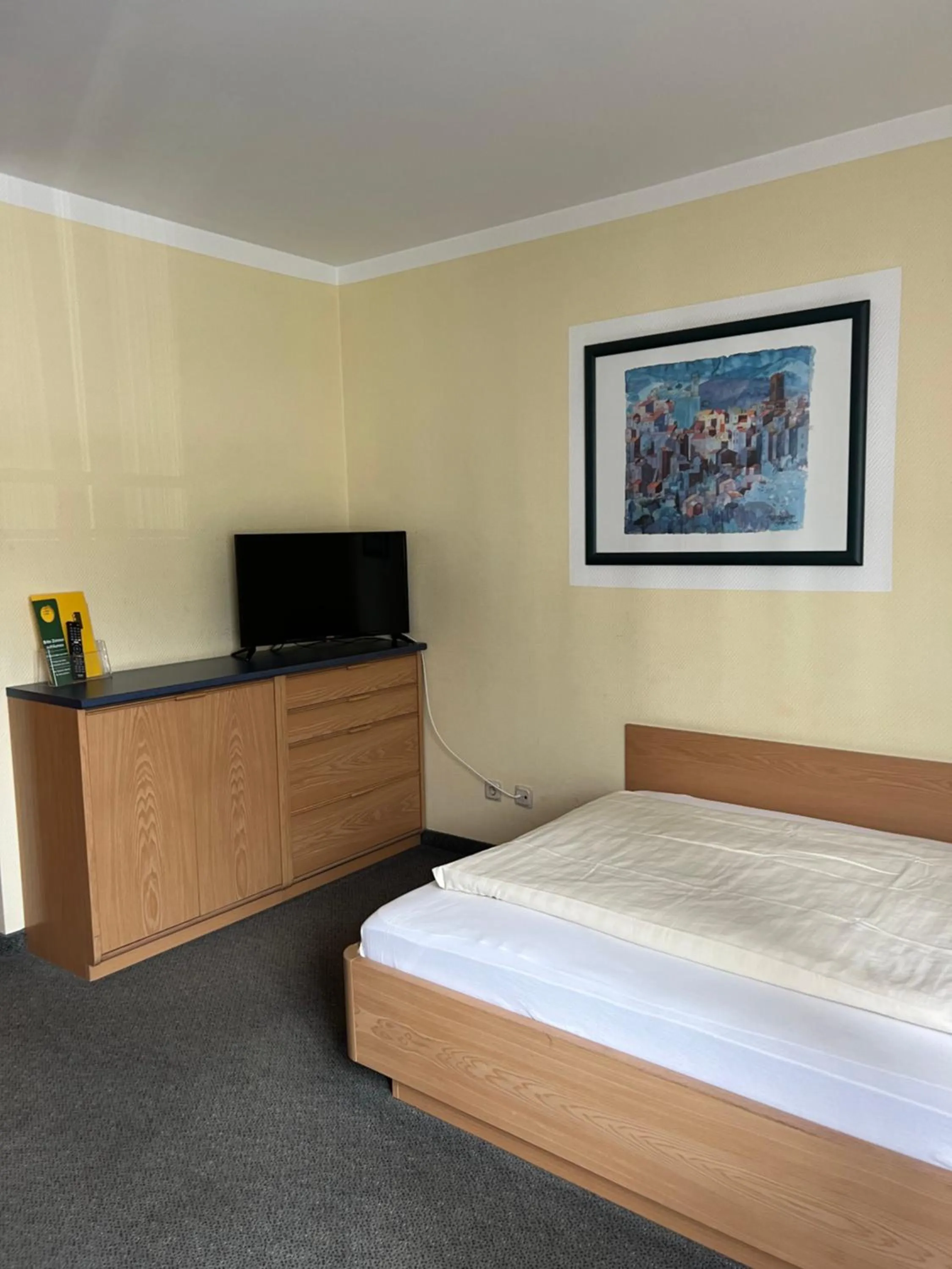 Communal lounge/ TV room, Bed in Hotel Aggertal