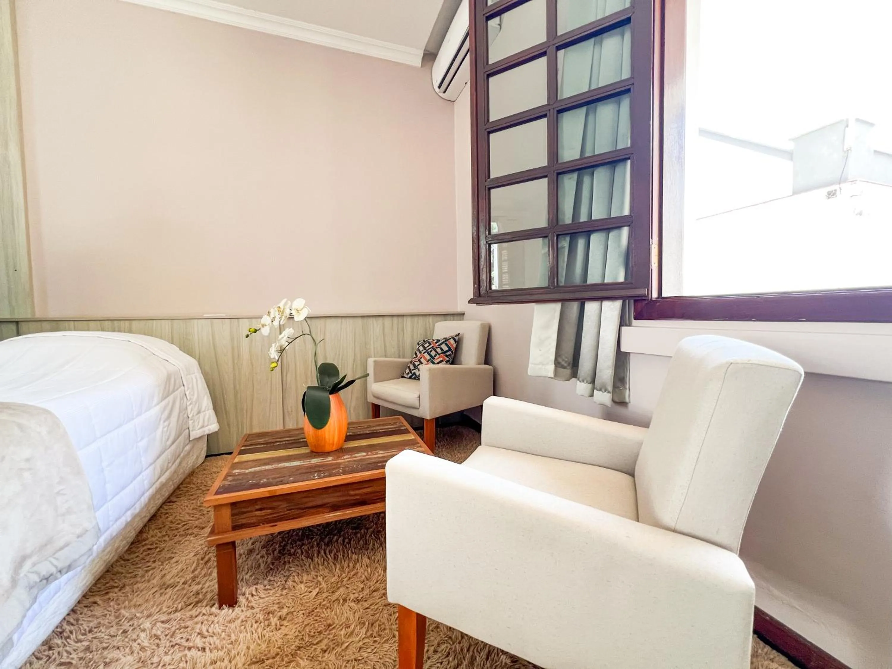 Seating area, Bed in Hotel Villa Souza Ltda