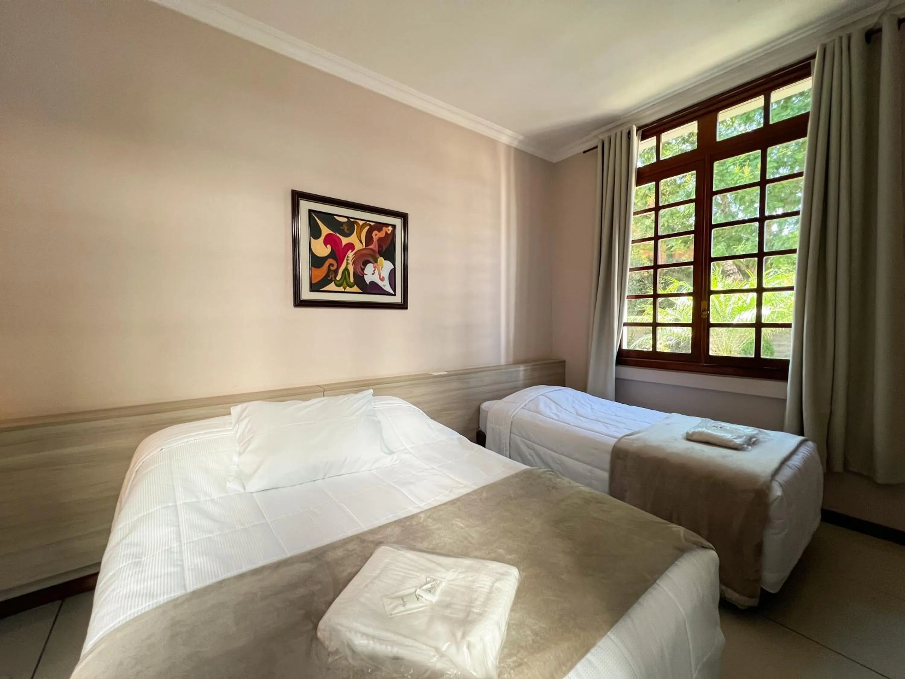 Bed in Hotel Villa Souza Ltda