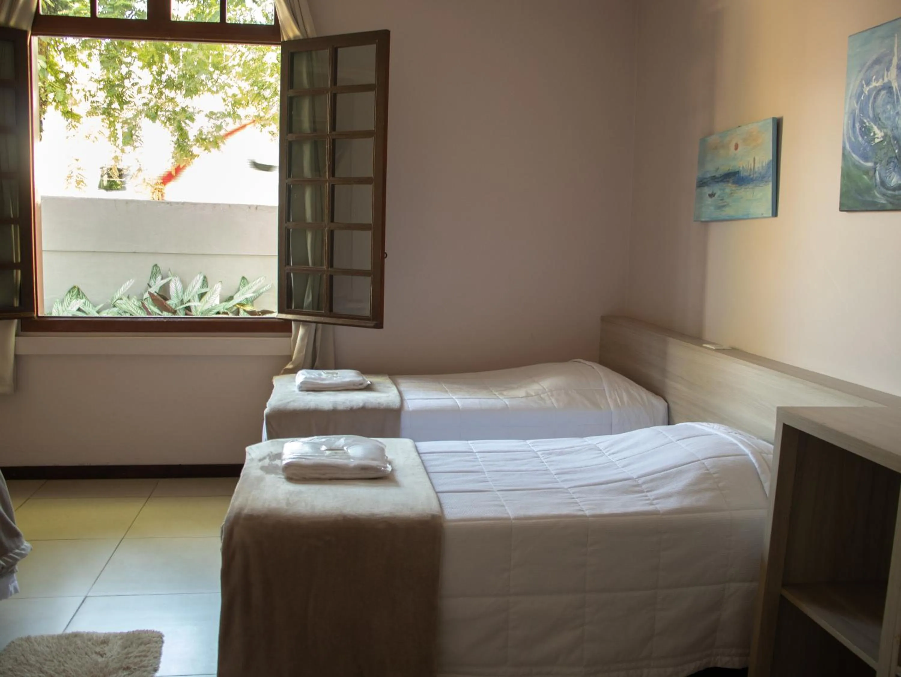 Bed in Hotel Villa Souza Ltda