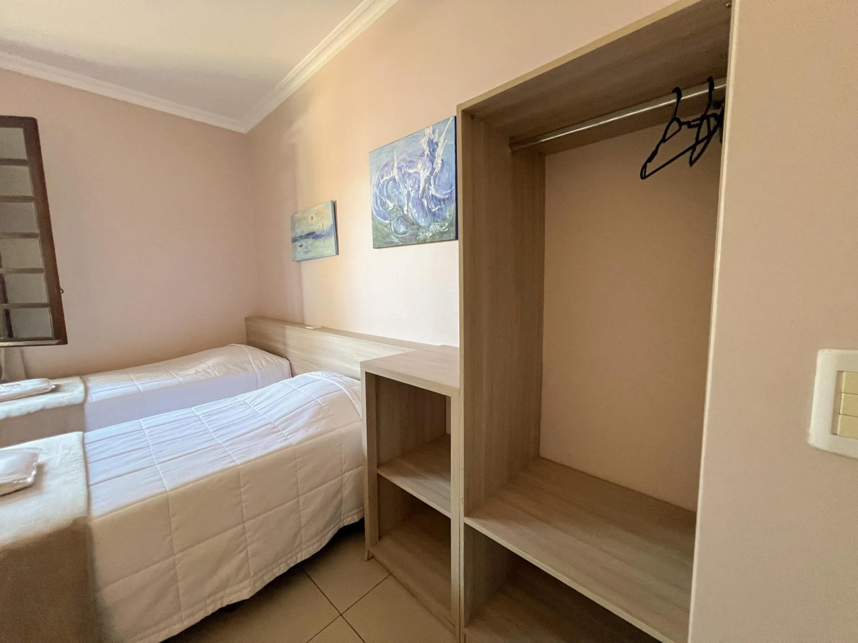 Bed in Hotel Villa Souza Ltda