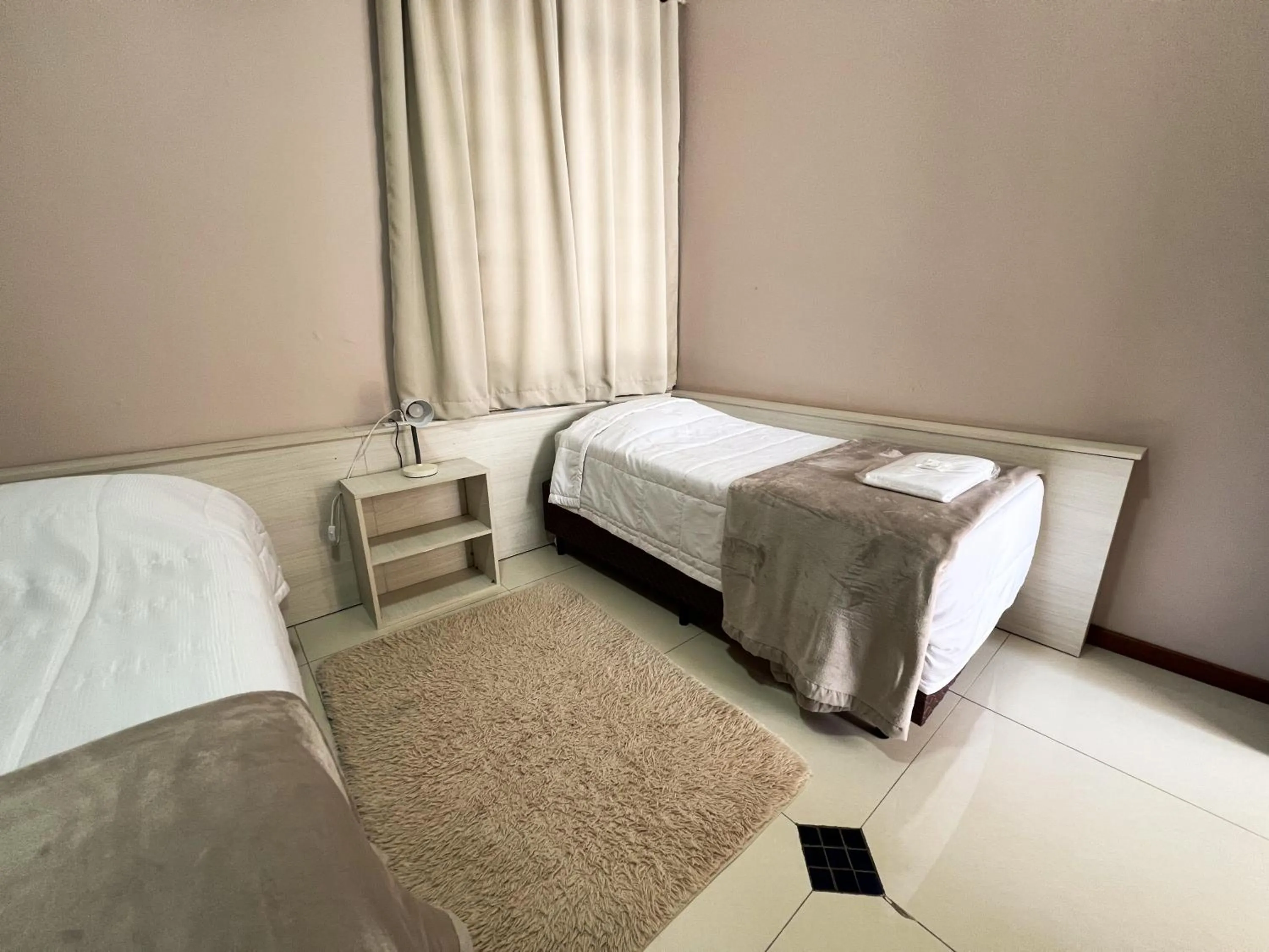 Bed in Hotel Villa Souza Ltda