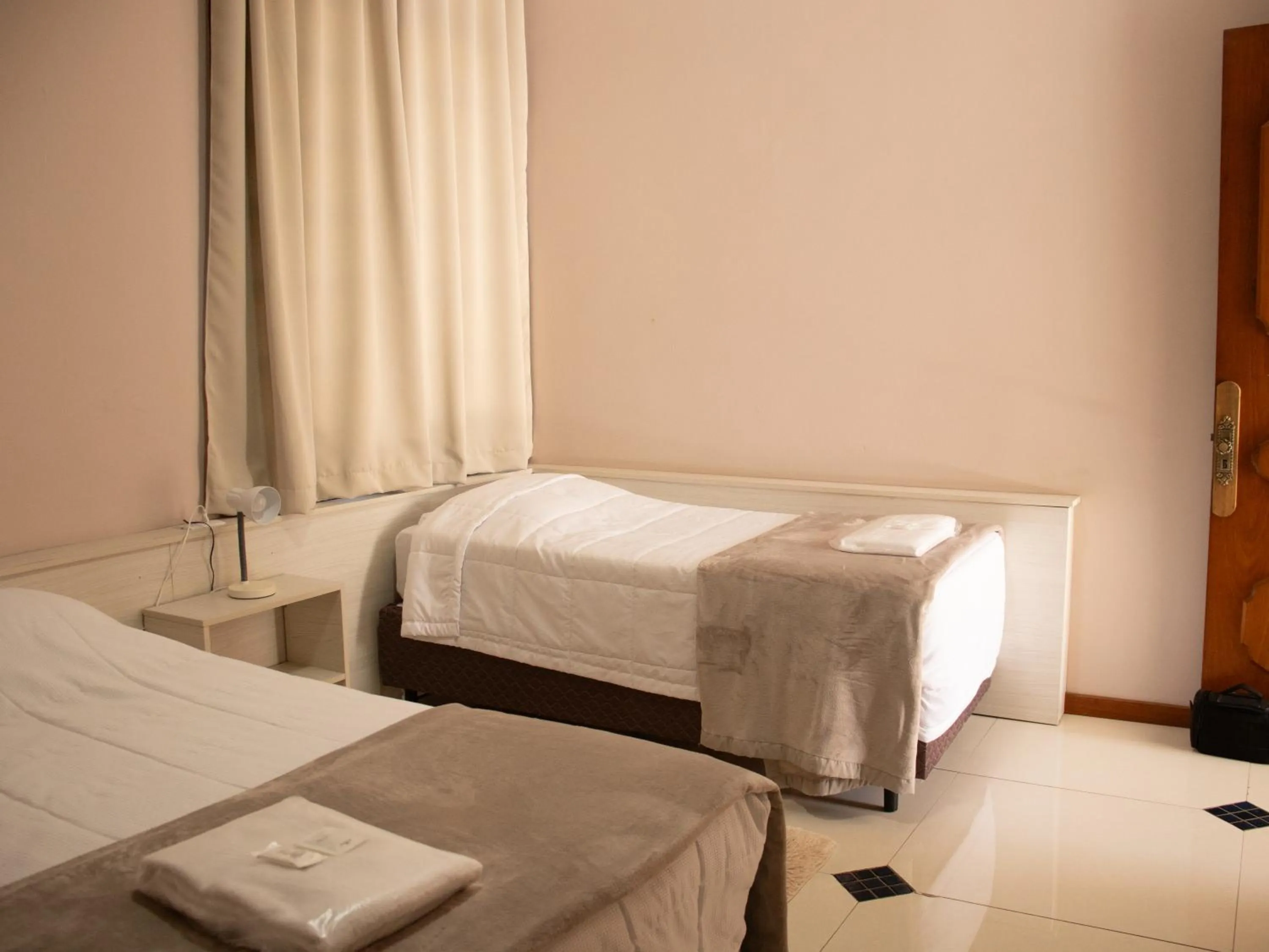 Bed in Hotel Villa Souza Ltda