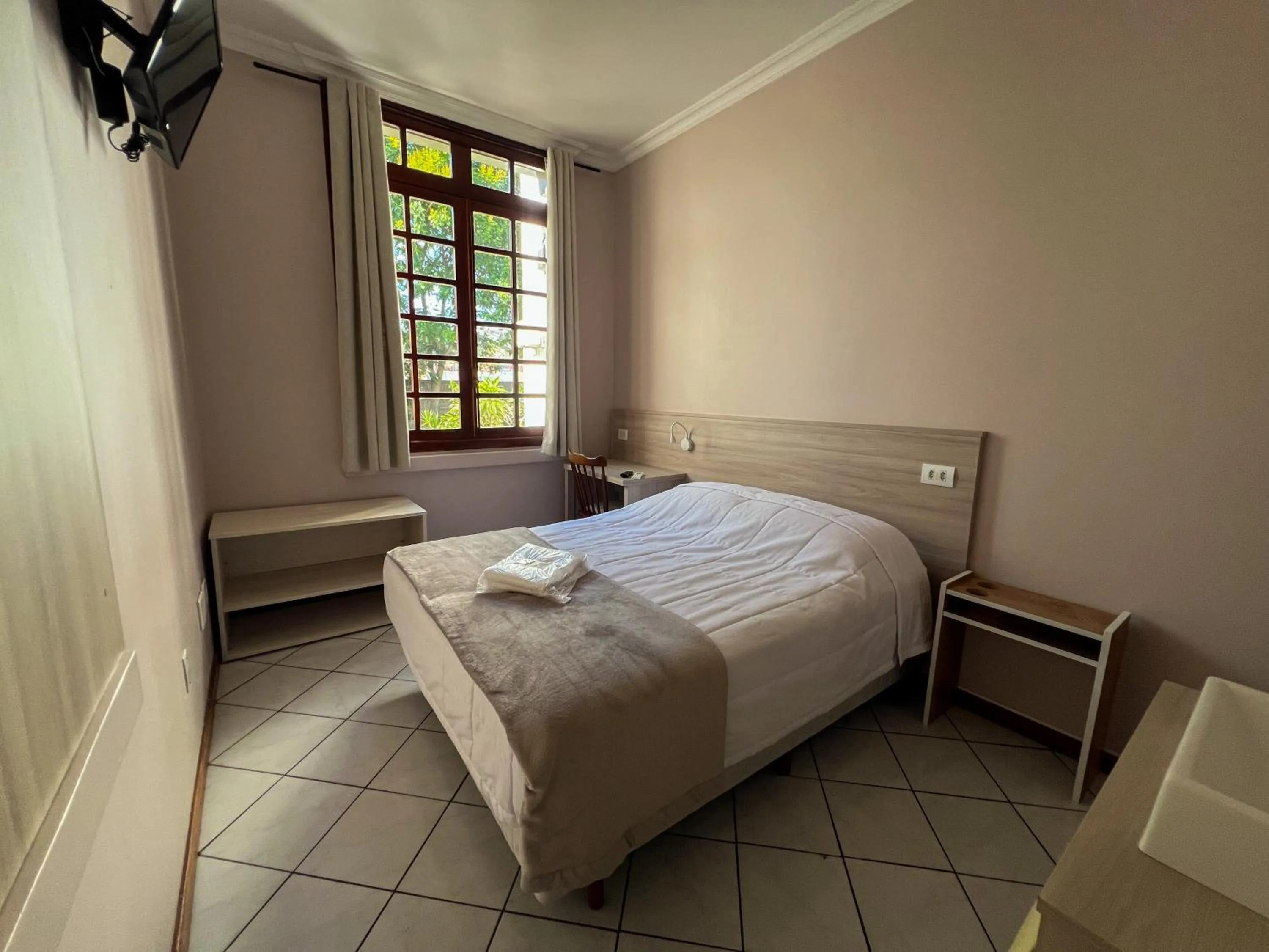 Bed in Hotel Villa Souza Ltda