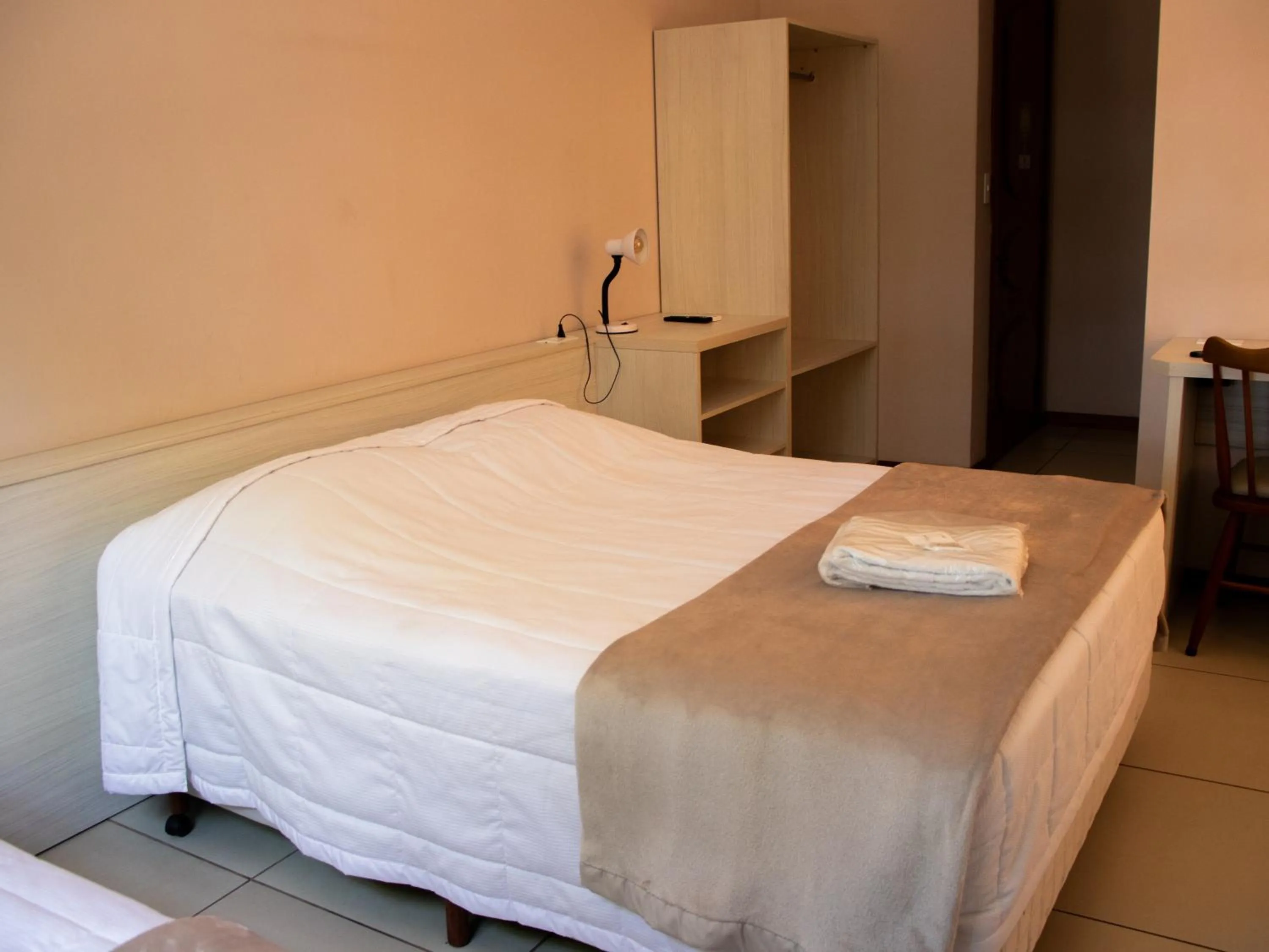 Bed in Hotel Villa Souza Ltda