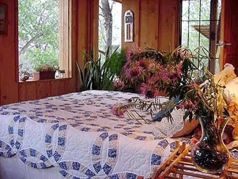 Bed in Silver River Adobe Inn Bed and Breakfast