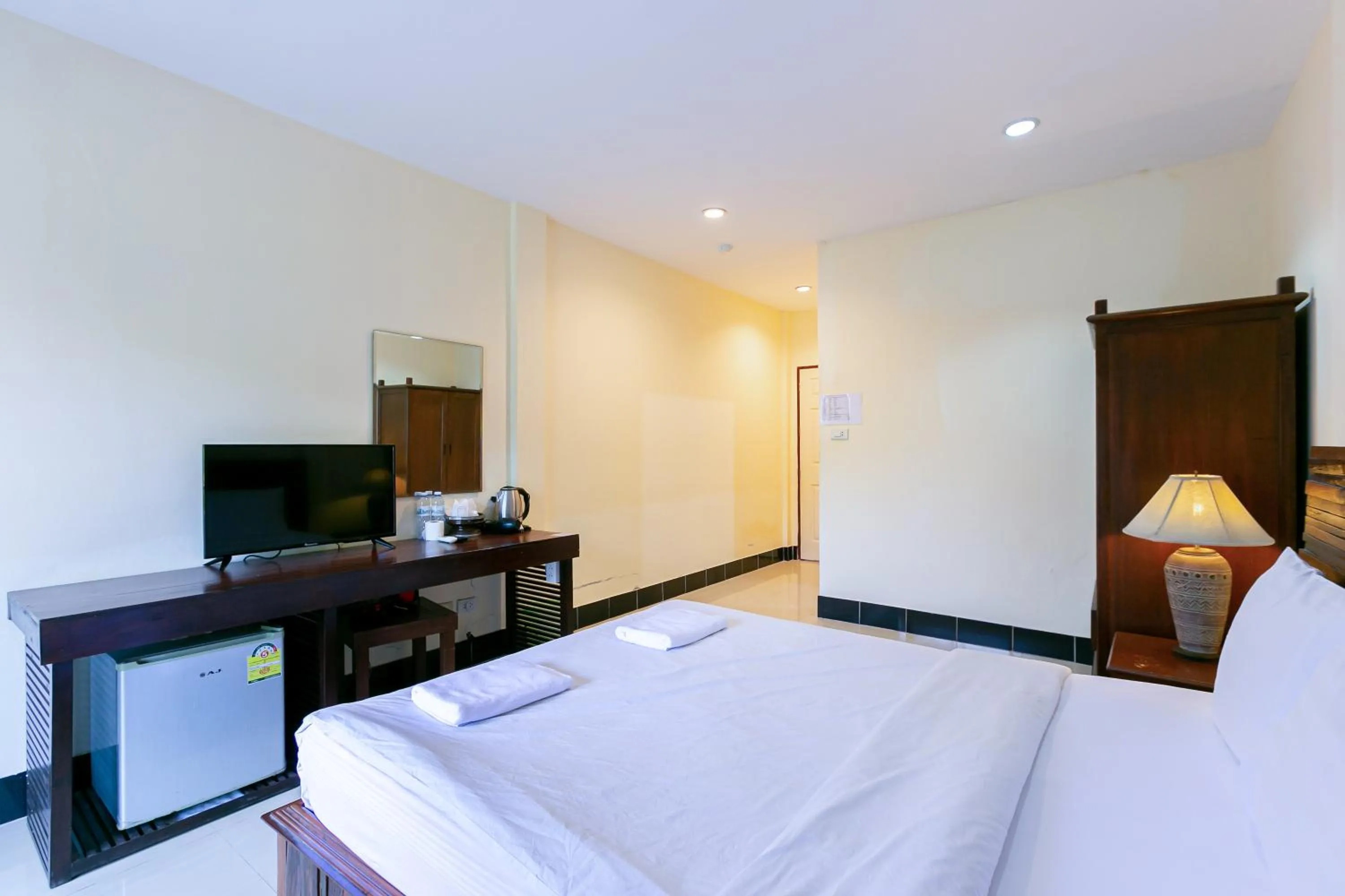 Bed in Deeden Pattaya Resort