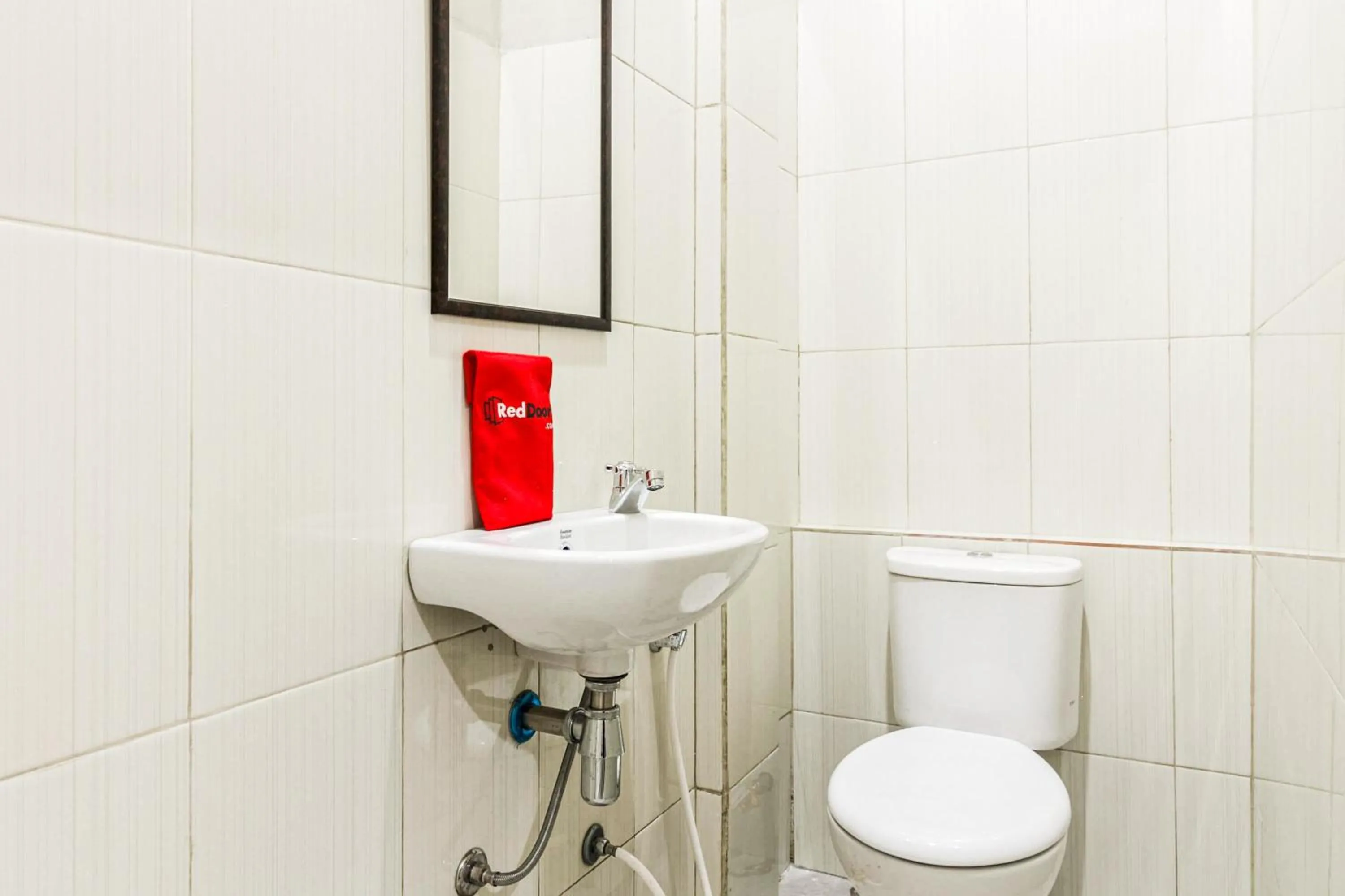 Bathroom in RedDoorz near Puri Indah Mall