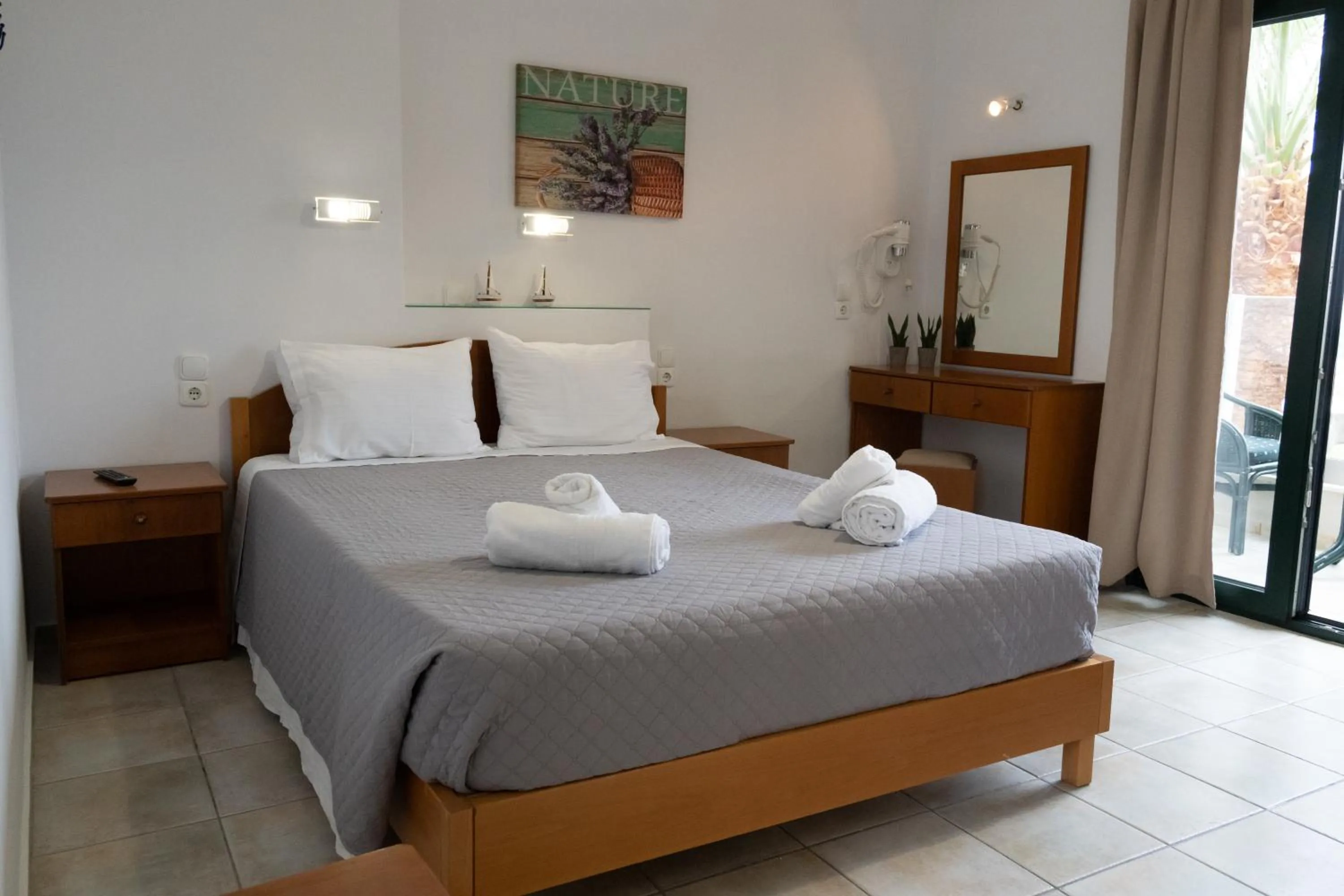 Bed in Aspri Petra Apartments