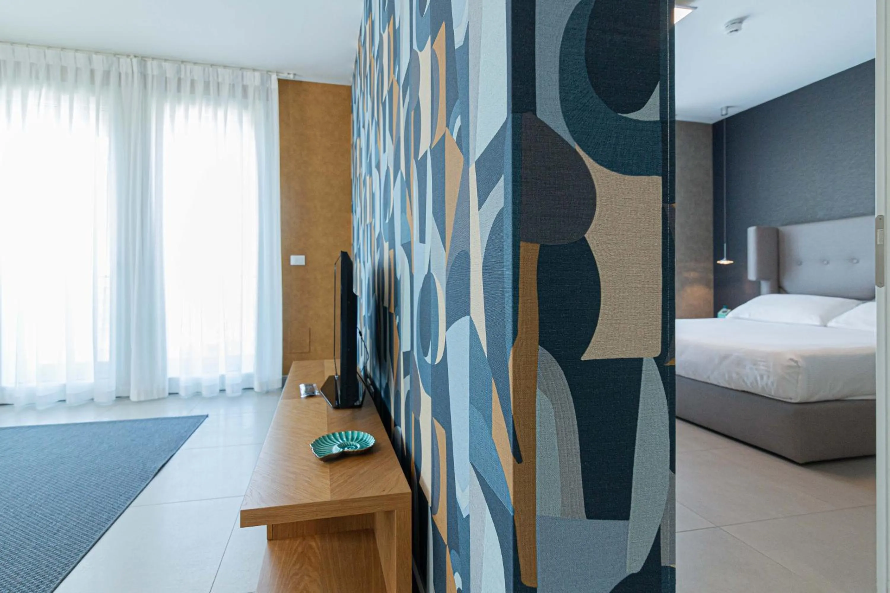 Bed in Mosella Suite Hotel