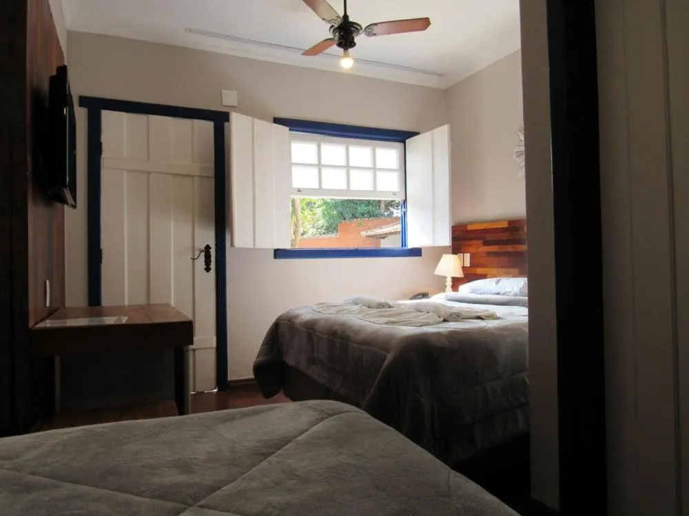 Bed in Pousada Mãe D'Água