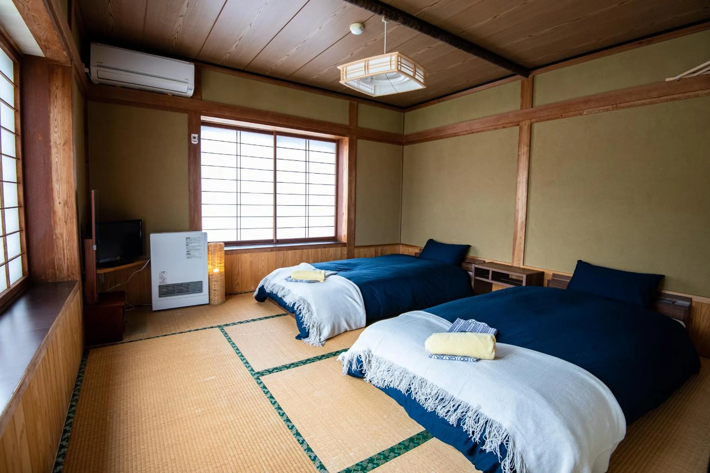 Bed in Toemu Nozawa Lodge