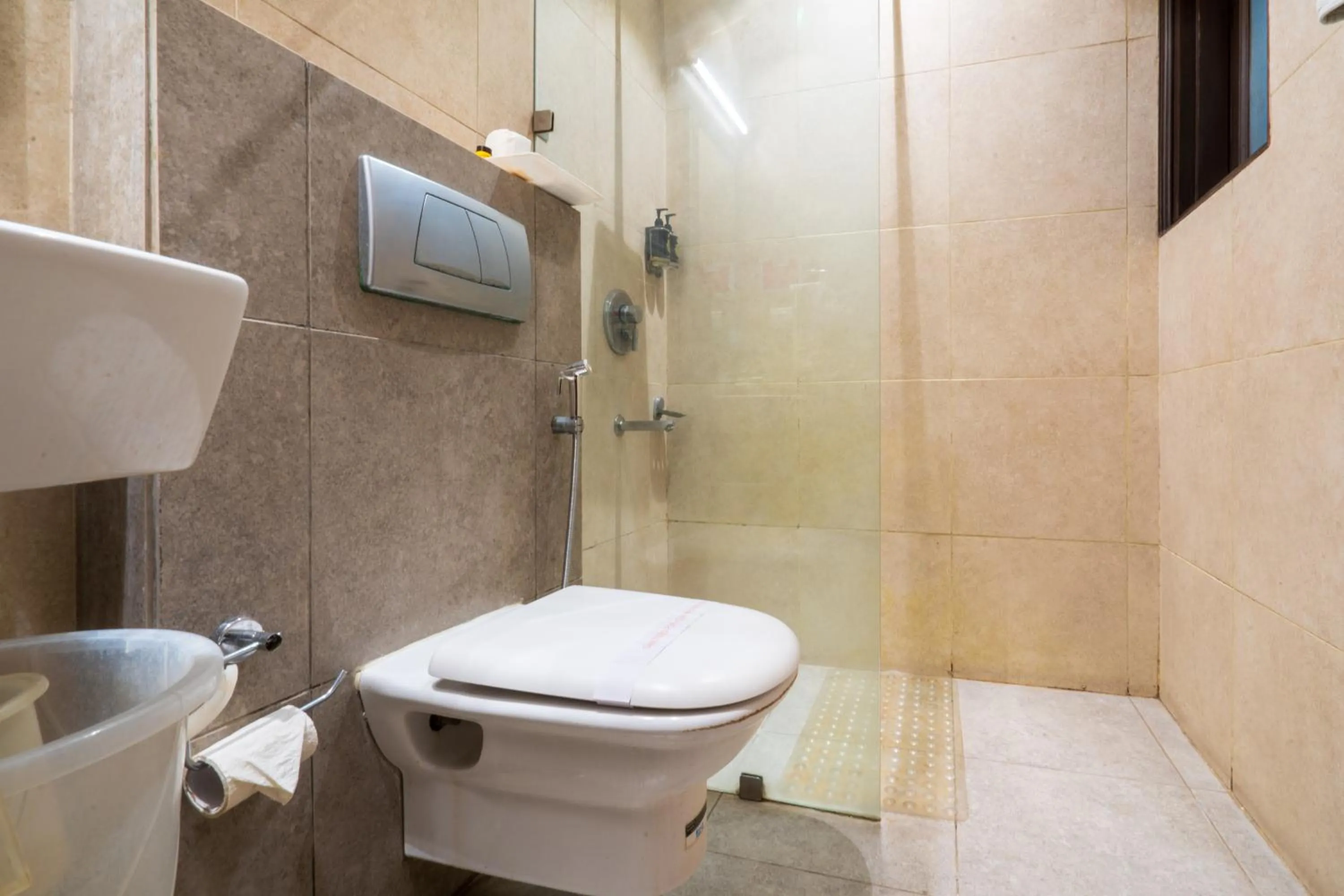 Bathroom in Cosy Grand, Chanakyapuri by The Cosy Hotels