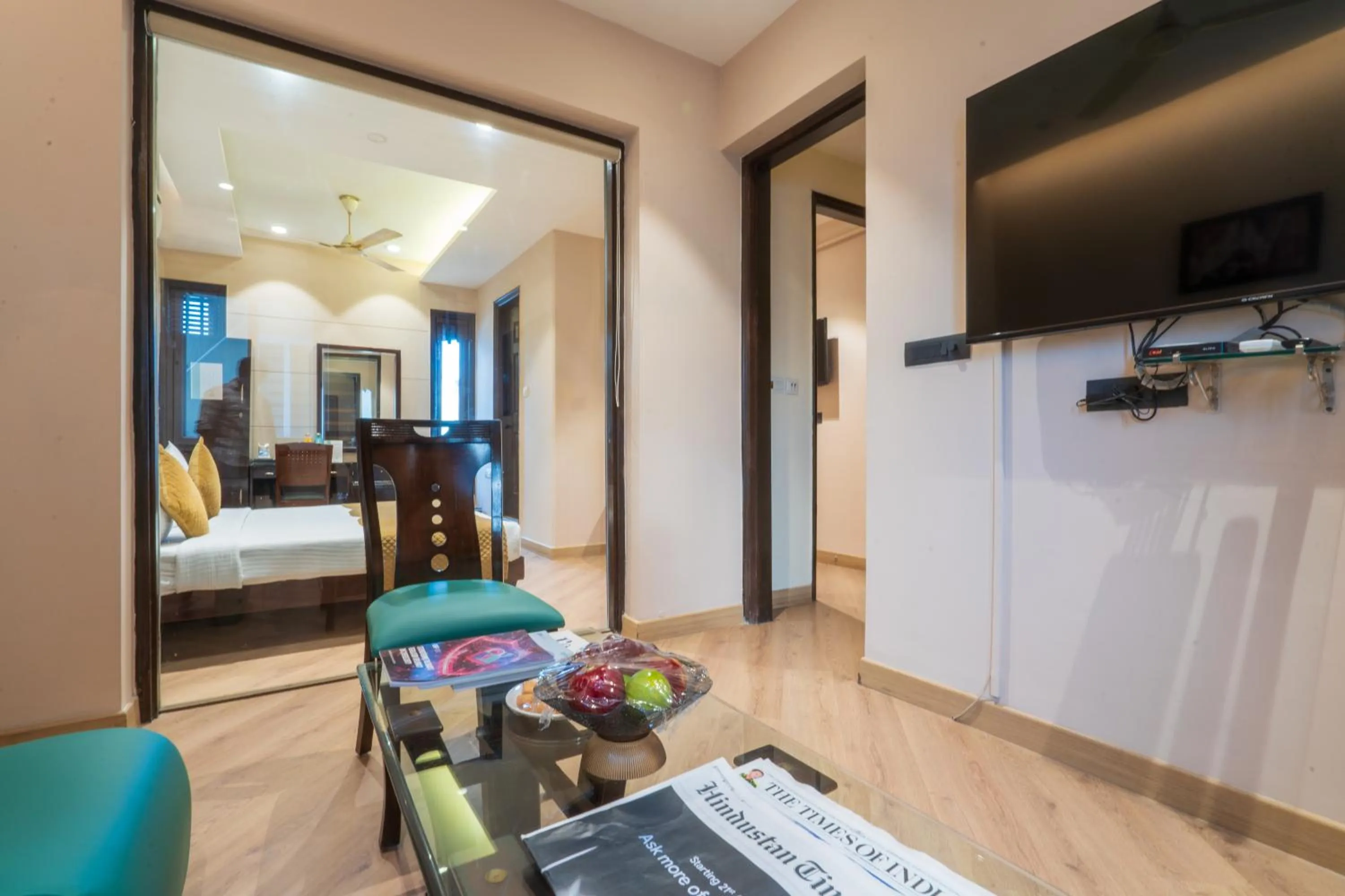 Photo of the whole room in Cosy Grand, Chanakyapuri by The Cosy Hotels