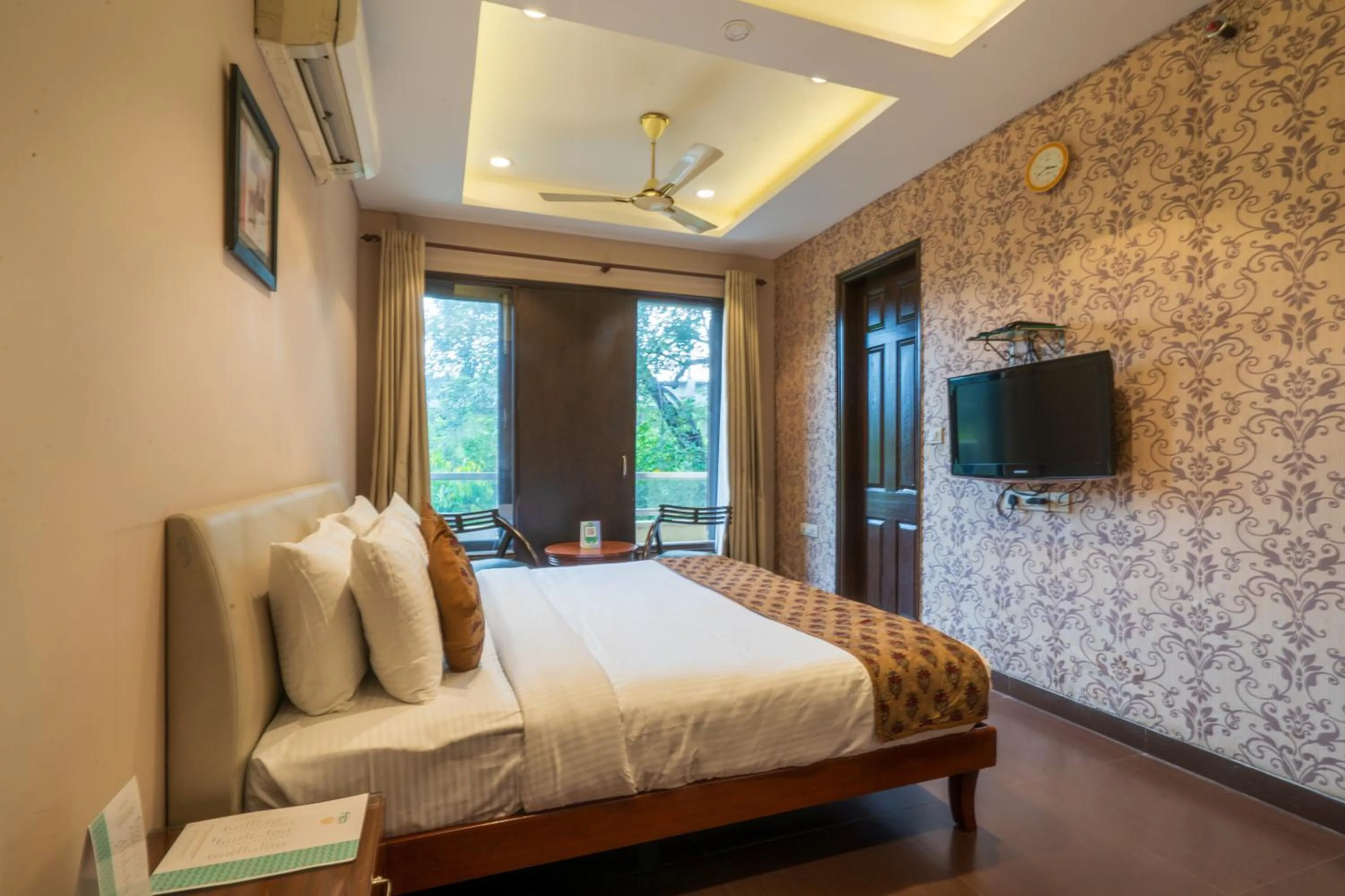 Bed in Cosy Grand, Chanakyapuri by The Cosy Hotels