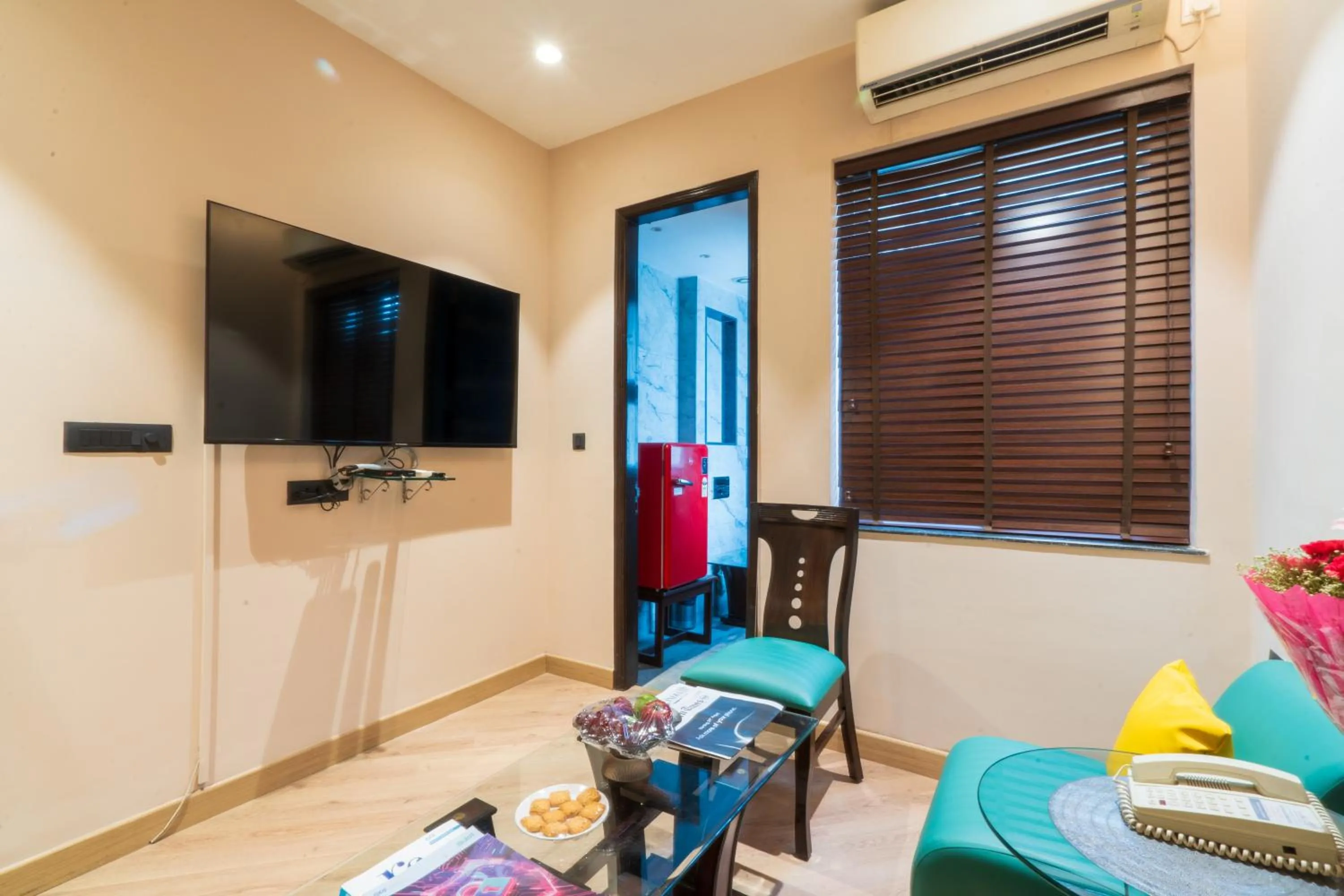 Seating area in Cosy Grand, Chanakyapuri by The Cosy Hotels