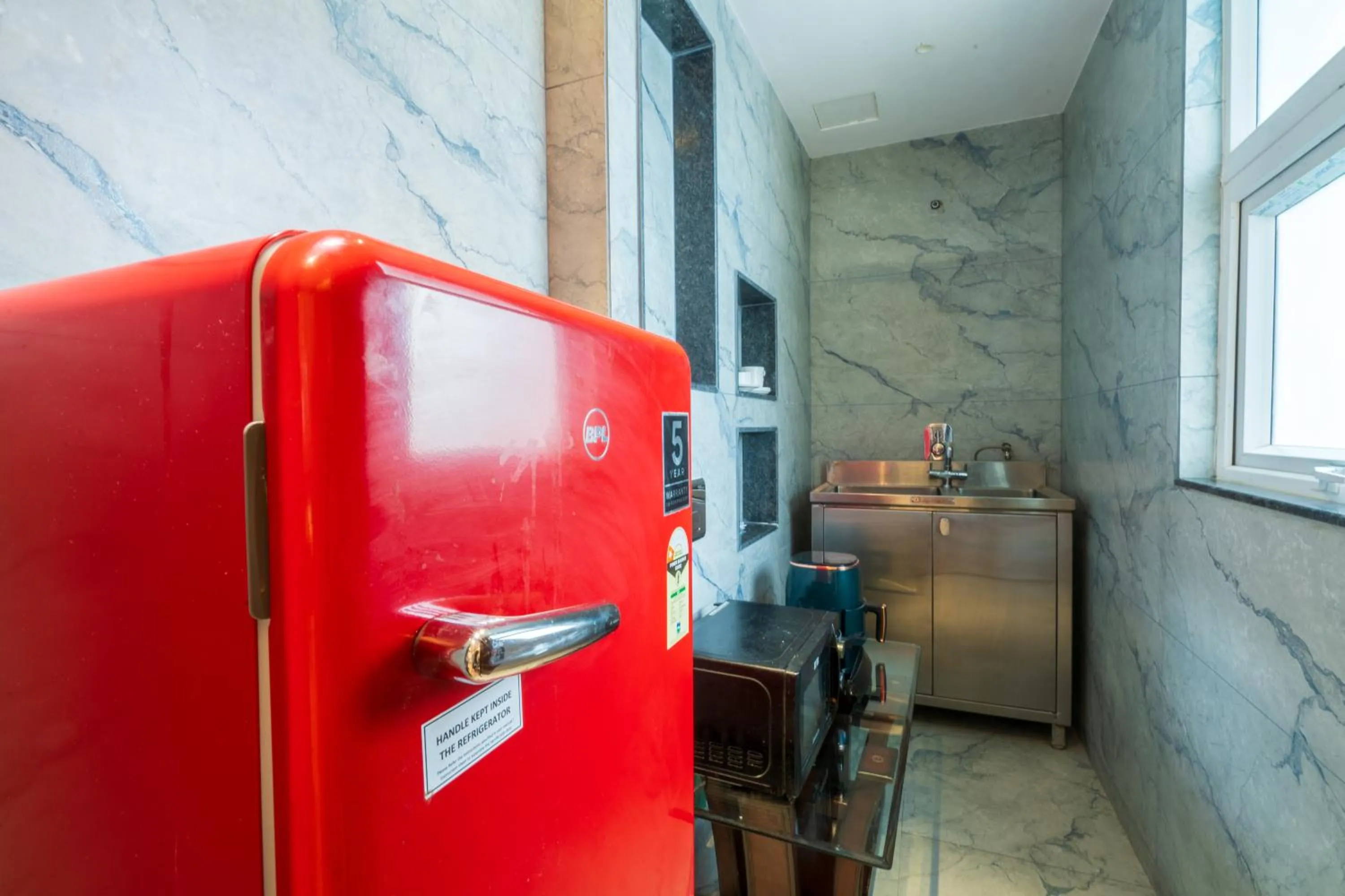 Kitchen or kitchenette in Cosy Grand, Chanakyapuri by The Cosy Hotels