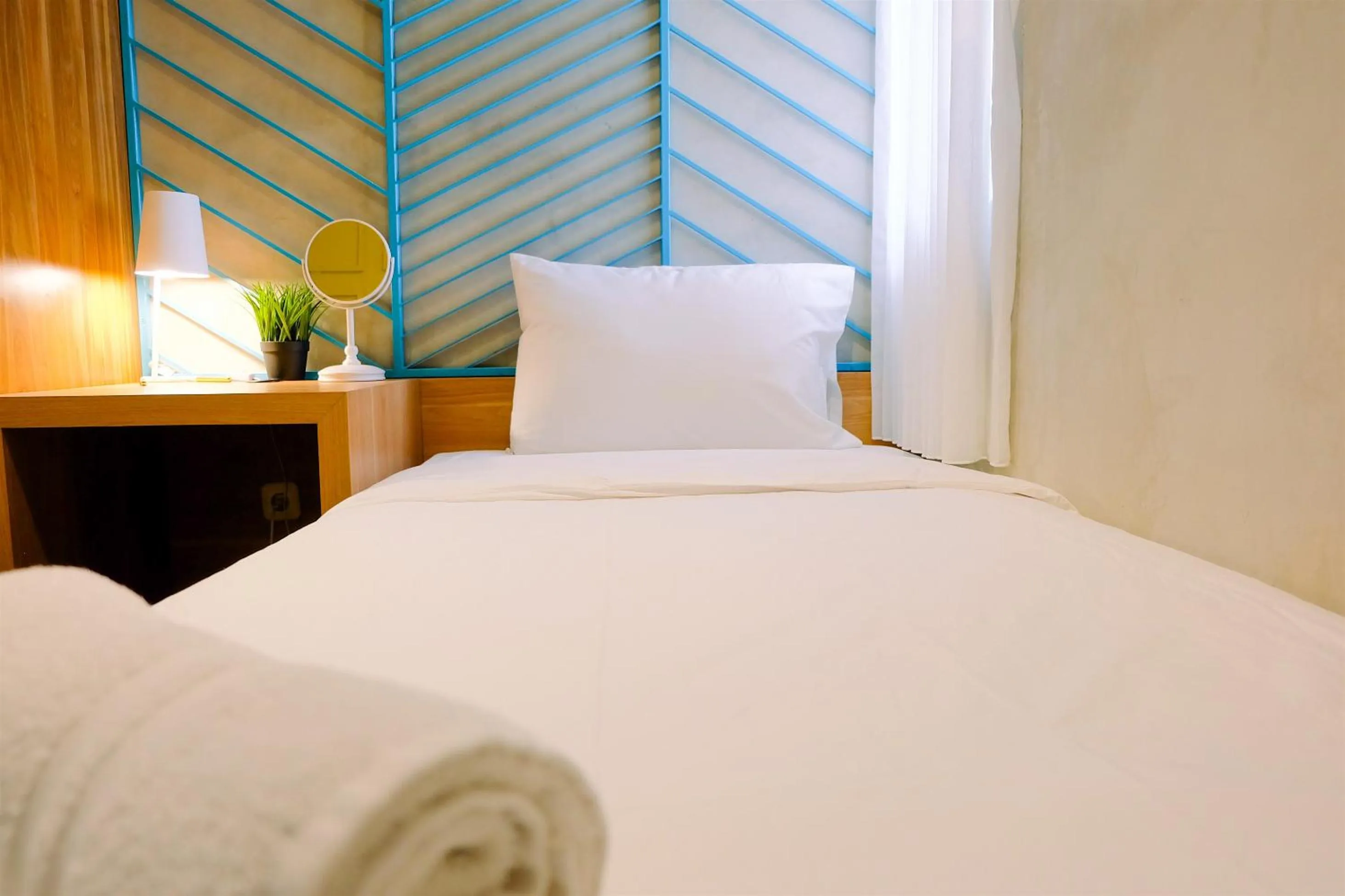 Bed in Modern and Stylish 2BR Pakubuwono Terrace Apartment By Travelio