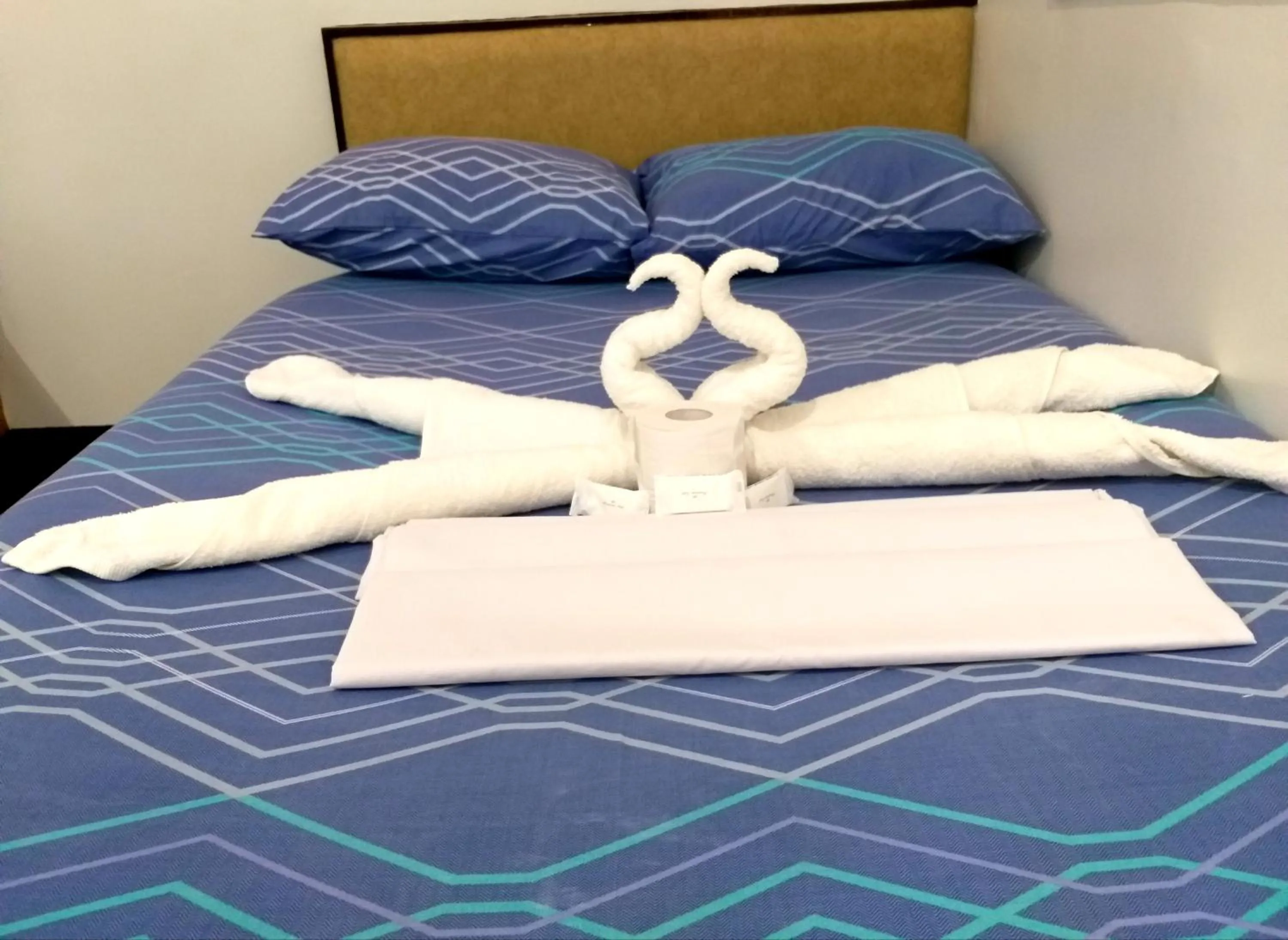 Bed in AMBIANZA APARTELLE