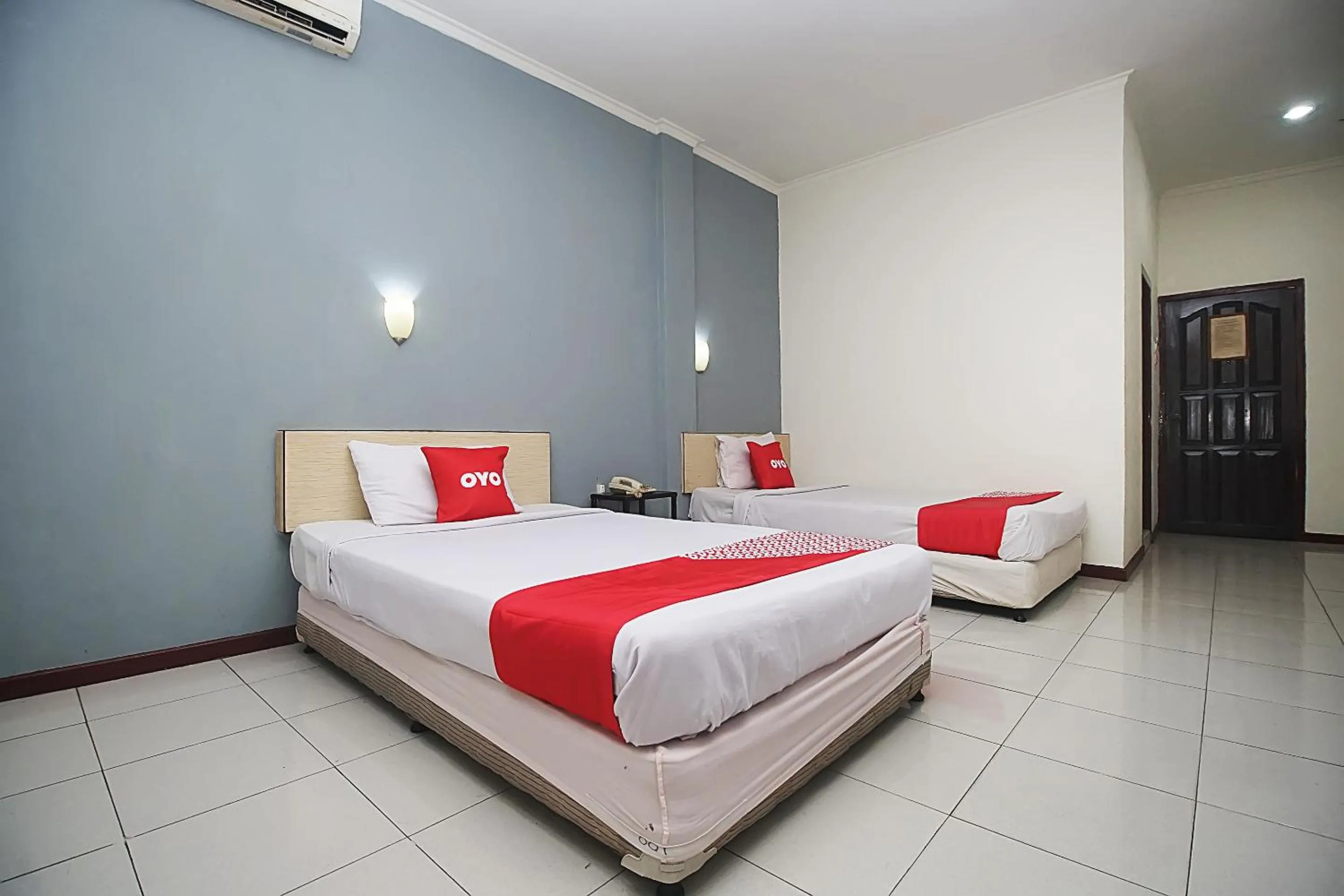 Bedroom in OYO 2079 Jambi Raya Hotel